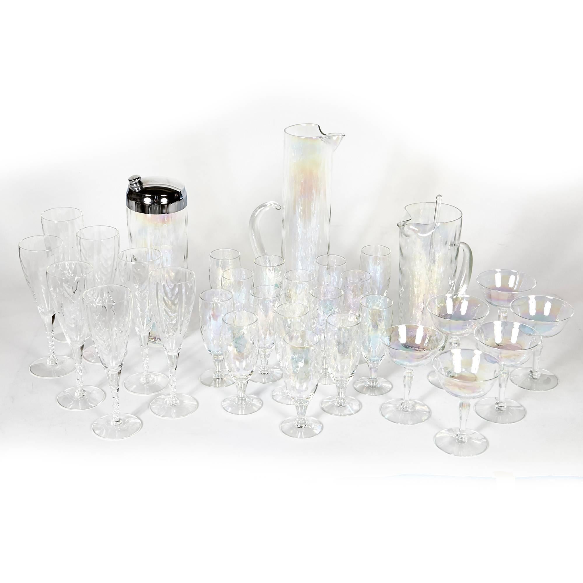 Vintage 1950s set of thirty-two vintage iridescent glass entertainment beverage set. The set measurements: tall handled pitcher 4