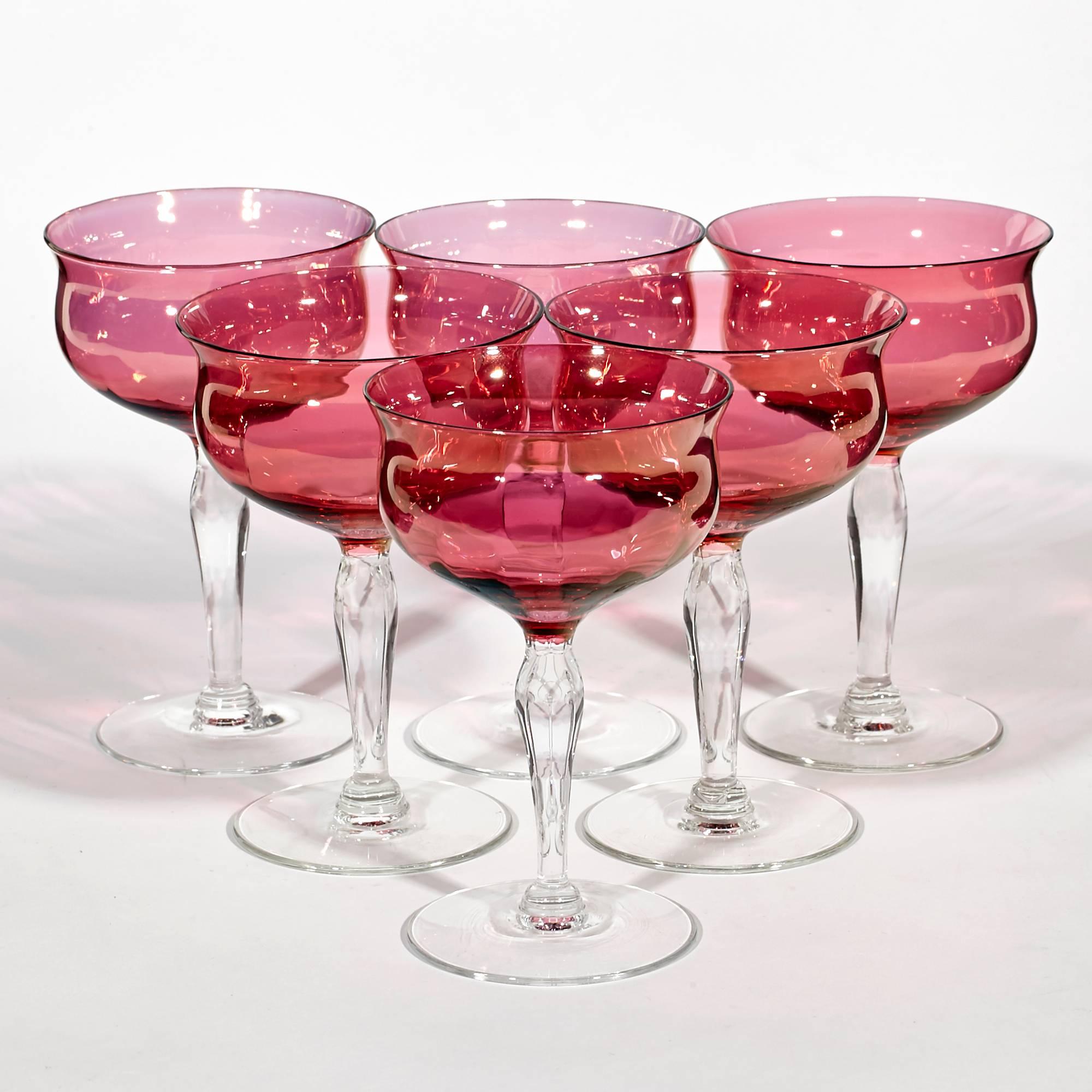 Vintage 1960s set of six cranberry glass bowl and clear stem glass coupe stems.