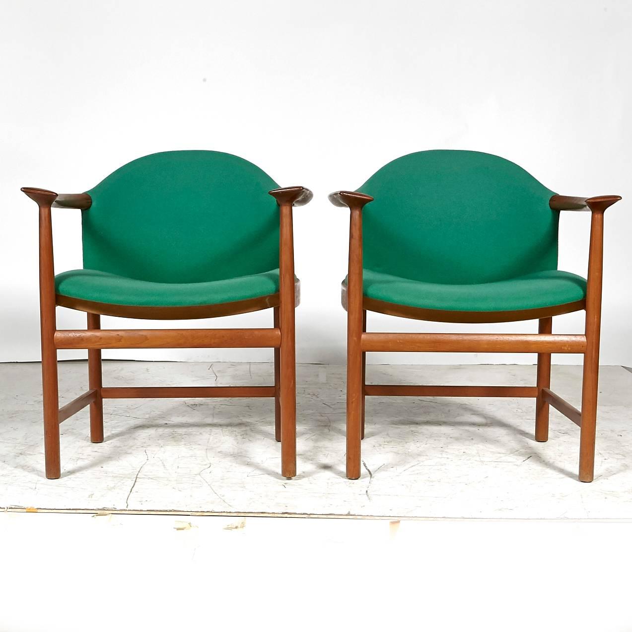 Danish teak set of six sculpted armchairs with original fabric. Seat 17in.H. Arm, 27in.H. Unmarked.