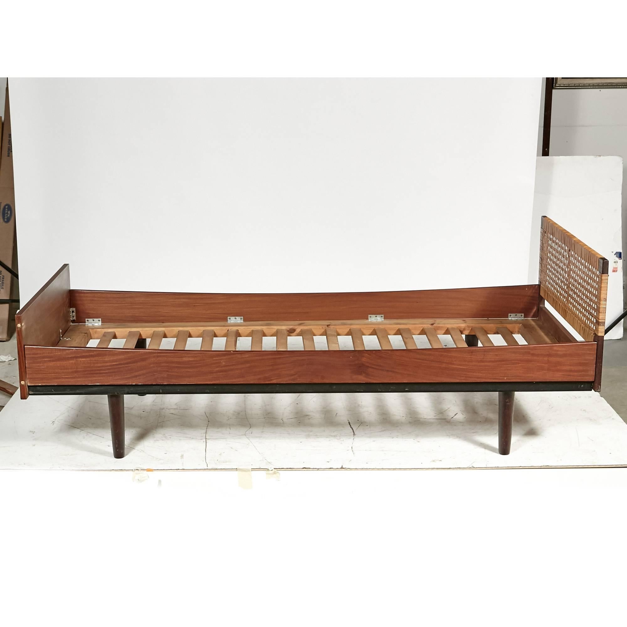 Danish teak child's single bed with a caned headboard designed by Hans J. Wegner for GETAMA, 1960s. Bed has slats included. Headboard detaches from the bed. No marks.