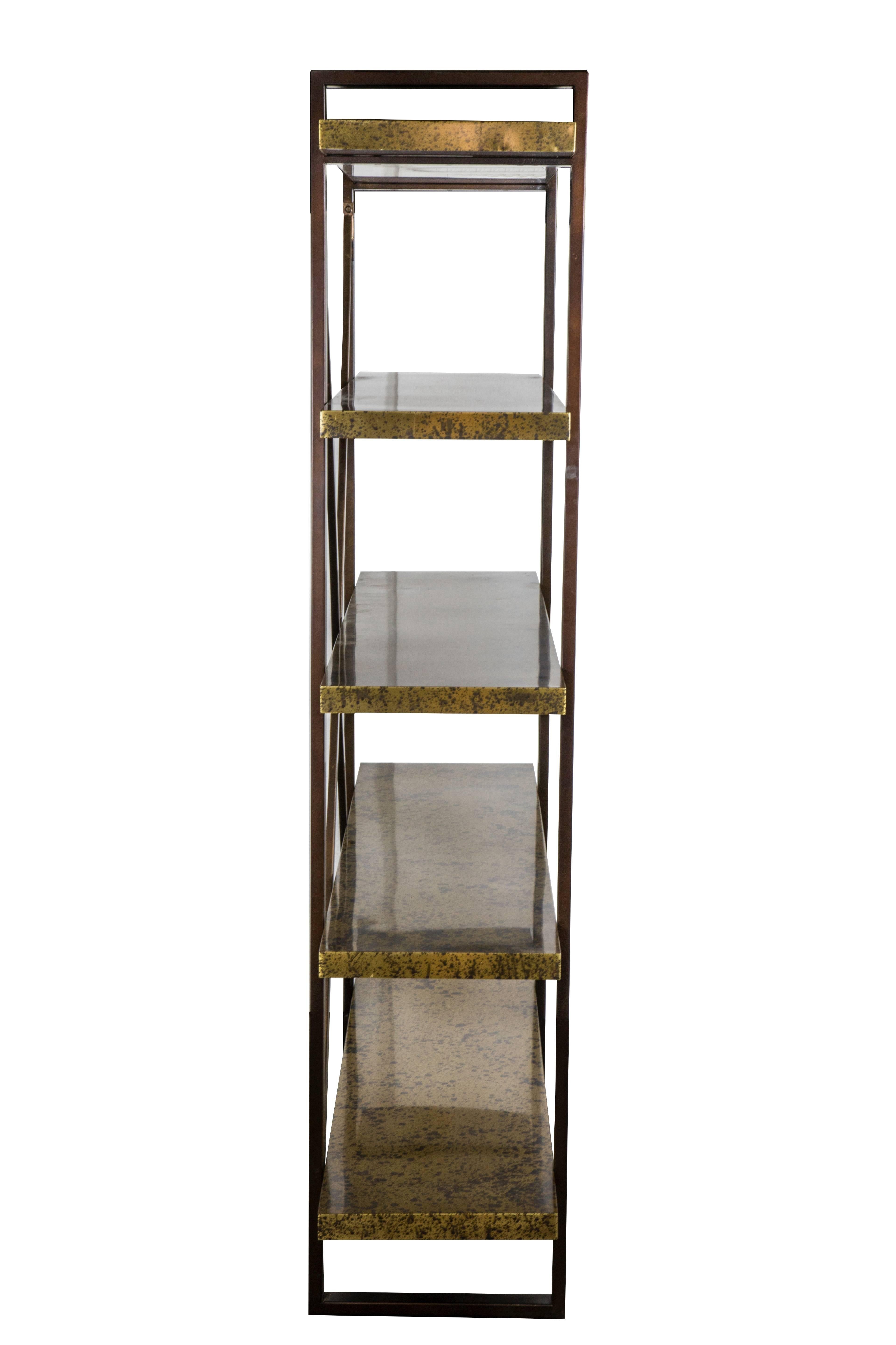 High quality brass and bronze finished Etagere. Shelves are solid wood veneered in sheet brass with retro acid finish. All remaining metal has an antiqued bronze finish. Ships fully assembled as a freestanding unit.