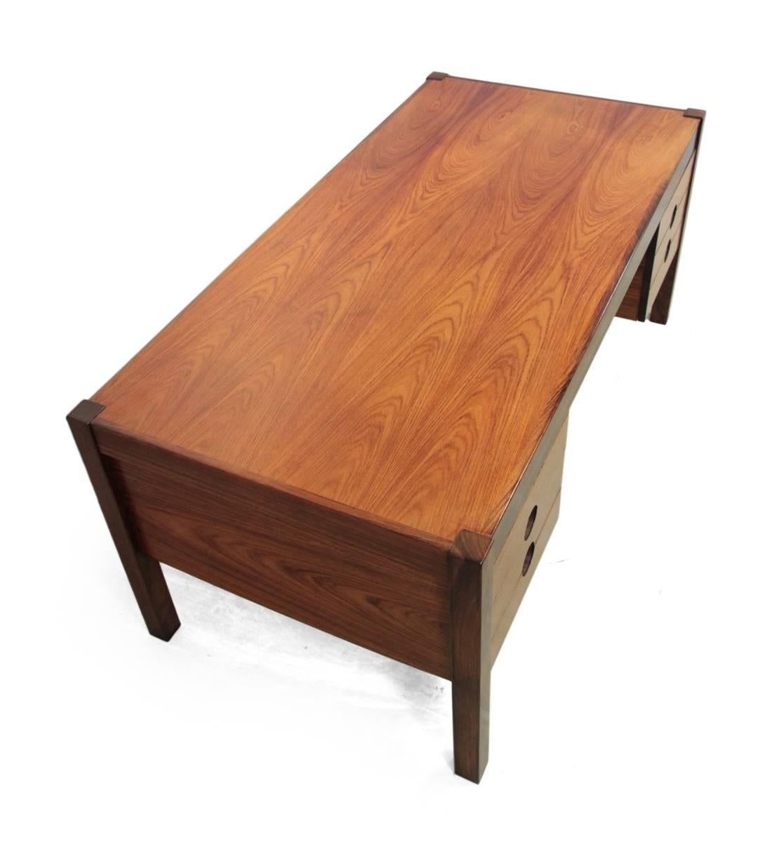 Mid-Century desk by Christian Linneberg.
This desk was designed and produced by Christian Linneberg Denmark in the 1960s. It is made from Indian rosewood and features details on the drawers, which have round sculpted handles. The desk features