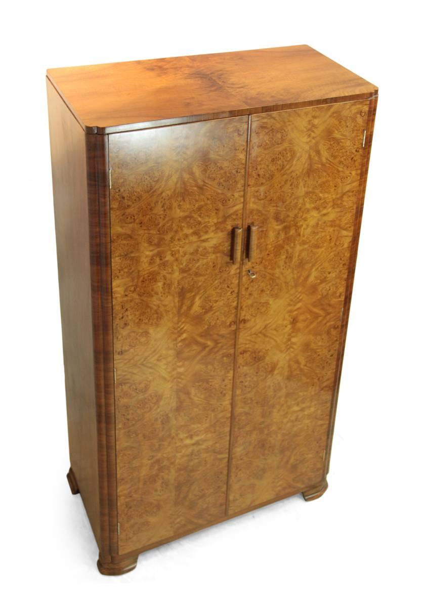 Art Deco walnut gentleman's wardrobe, circa 1930.
This good quality Art Deco wardrobe has two doors with stunning burr walnut figuring, this has fitted interior including sliding hang rail. This wardrobe has been fully restored and polished.
Age: