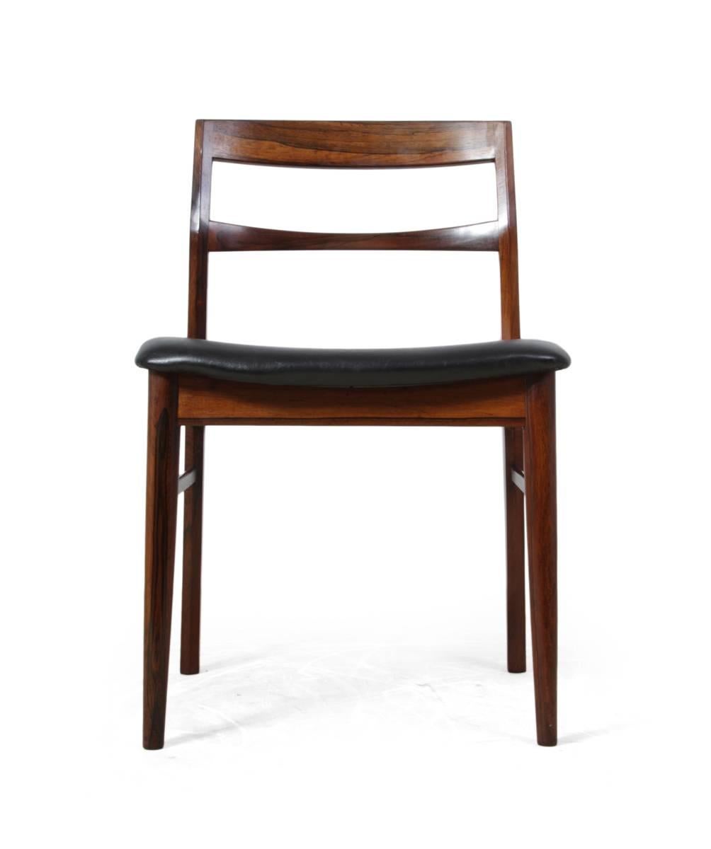 Mid-Century dining chairs by Rosengren Hansen.
A set of six rosewood dining chairs by Henry Rosengren Hansen for Brande Møbelindustri. Produced in the early 1960s using the finest quality solid rosewood
the seats are upholstered in faux leather,