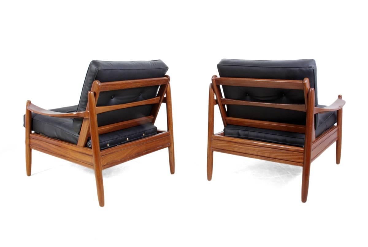 Pair of Mid-Century teak framed leather armchairs, circa 1960.
A pair of Danish produced Teak framed leather armchairs, these chairs have been fully polished and have had new leather upholstery, they are sprung under the seat and each chair has a