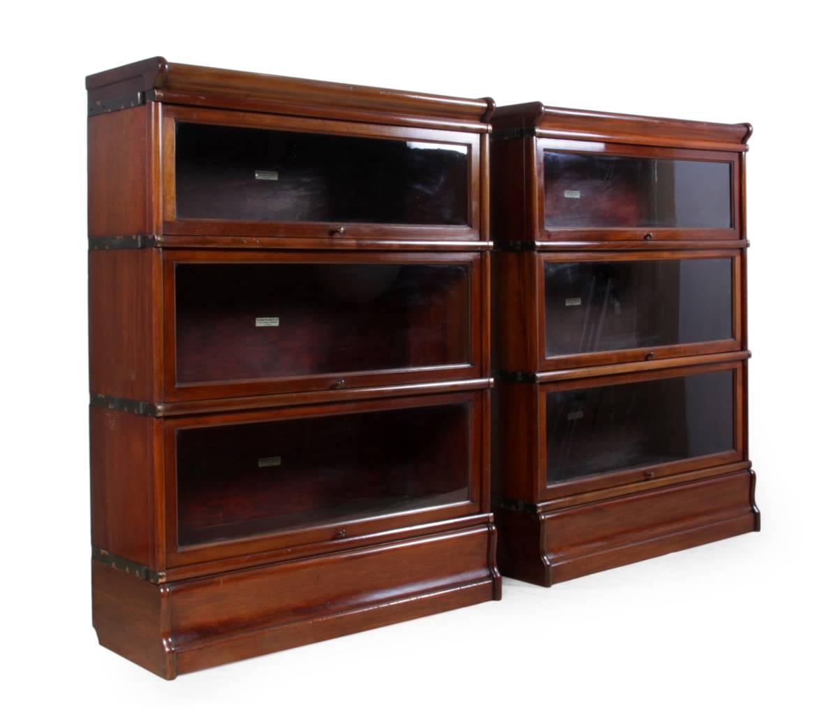 Pair of mahogany Globe Wernike stacking bookcases.

A pair of three stacking bookcases five sections each, in mahogany with glass sliding doors, in very good vintage condition, circa 1920.

Age: circa 1920.

Style: Antique.

Material: