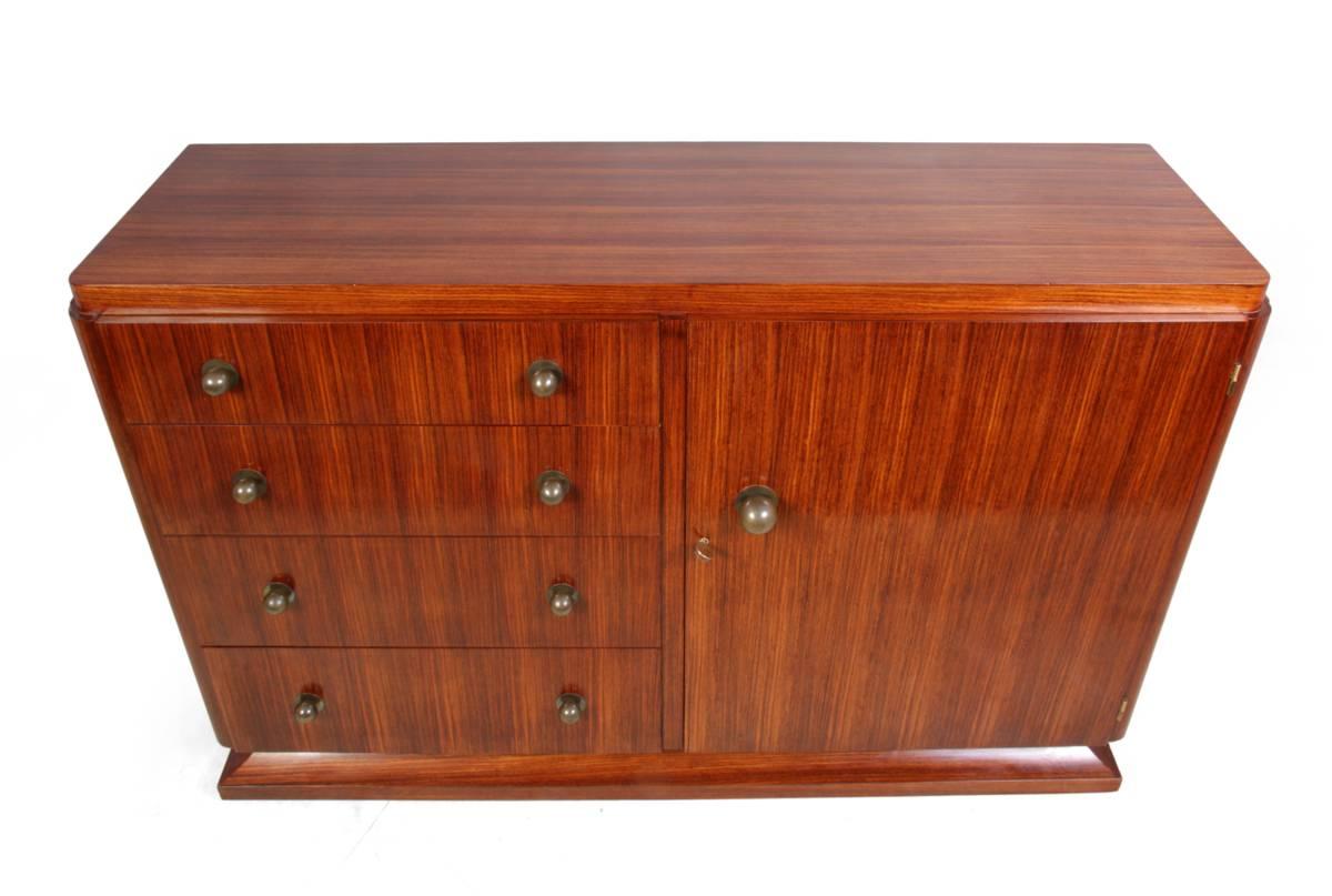 Art Deco sideboard in rosewood, circa 1920, France
A very good example of French Art Deco, having four drawers to the left and a cupboard with shelves to the right bronze patinated handles and original key, all in fully polished showroom condition