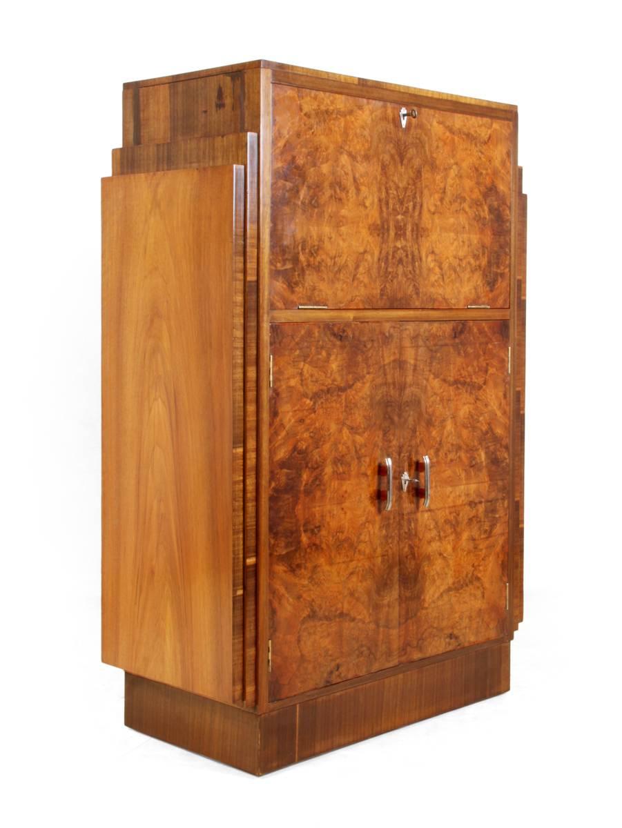 Art Deco walnut bureau, circa 1930
British made Art Deco bureau has a fall down front and cupboard below, the fall inside has new leather inlay writing surface and a good looking interior. This bureau has been restored and newly polished and is in