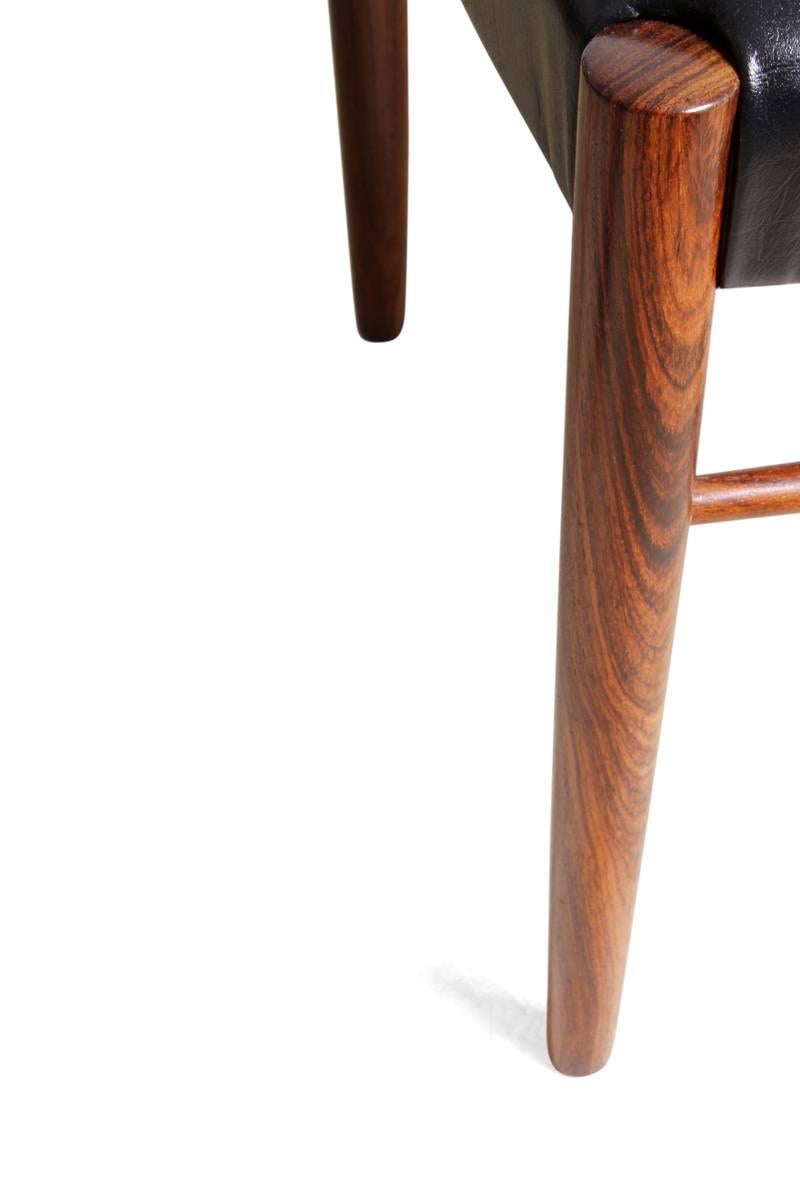 Set of six dining chairs by H W Klein for Bramin
Produced in the 1960s from solid rosewood, this set of 6 chairs (five side chairs and one carver) are solid with no breaks or movement in the joints, we have re upholstered in thick hide