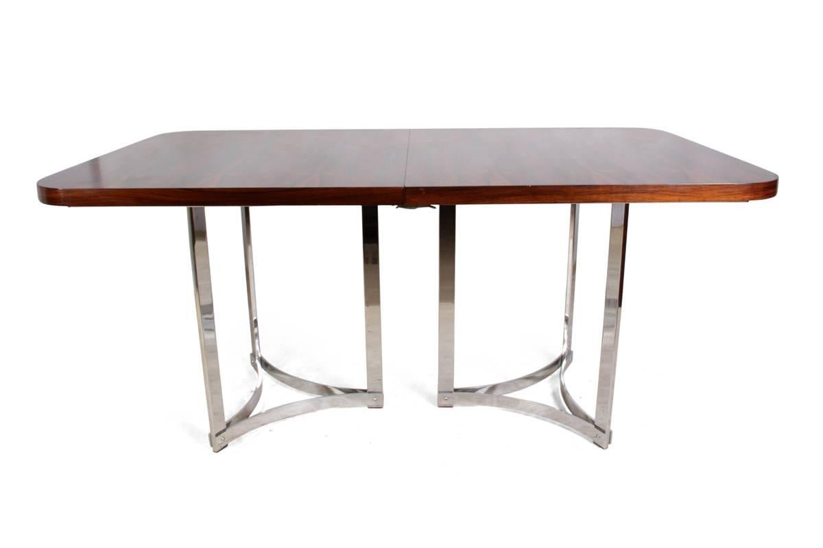 Rosewood and chrome dining table by Merrow Associates
A very rare extending dining table to seat 10 people in Rosewood, with chromed steel base. Designed by Richard Young for Merrow Associates in the early 1960s. The table is in excellent condition