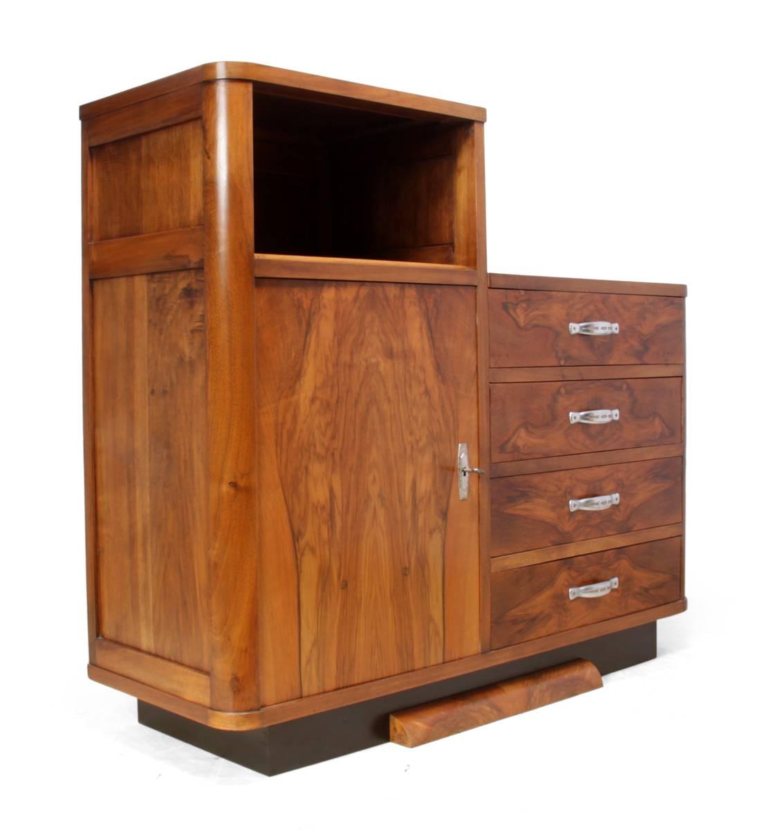 Art Deco walnut cabinet, circa 1930
This Art Deco chest has four drawers and a cupboard with adjustable shelves behind, produced in France in the 1930s with dovetail joint construction. This walnut cabinet has been professionally restored and hand
