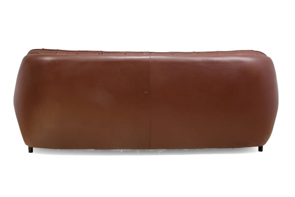 Retro sofa in buttoned brown leather
This organic shaped, retro sofa has full buttoned cushioned seat and back, will seat up to four people, there is a small repair to the back but otherwise this sofa is in very good condition with minimal