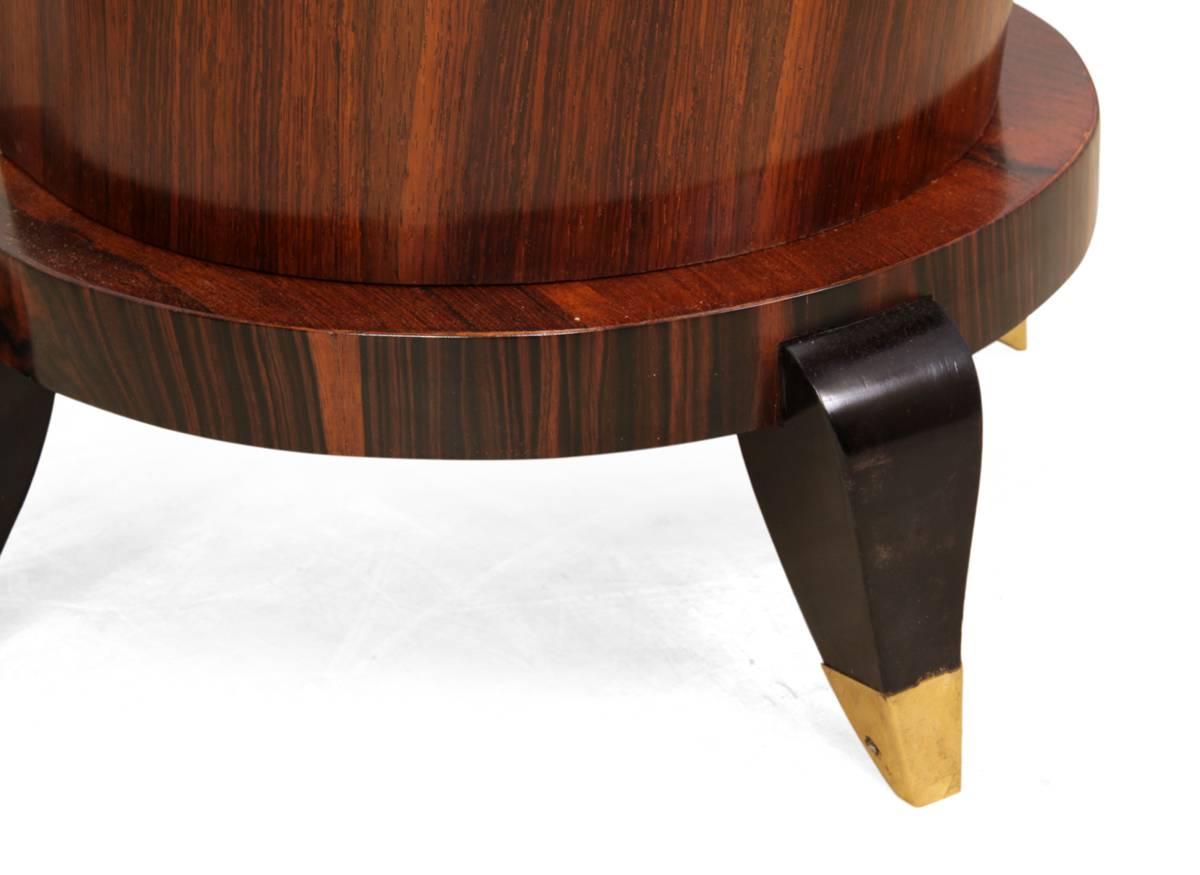 Pair of Art Deco console tables, Italian, circa 1930
A pair of Italian dimilune console tables in rosewood and cross banded in Macassar ebony, standing on ebonized brass tipped feet, with leaning demilune central column with beading detail this