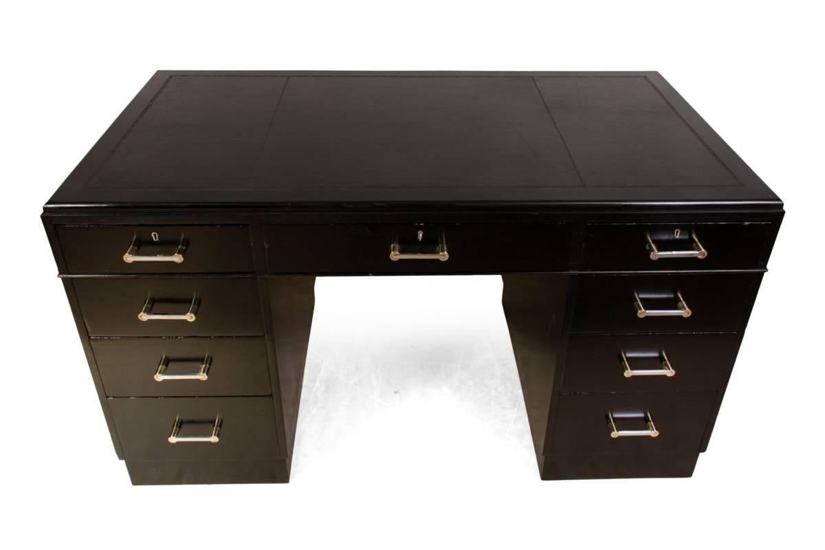 Black Art Deco desk, circa 1930
This oak desk has been ebonized with a piano finish, it has nine drawers three of which are lockable one key supplied, the handles are a mixture of chrome and brass this desk has a new leather inset top and is in