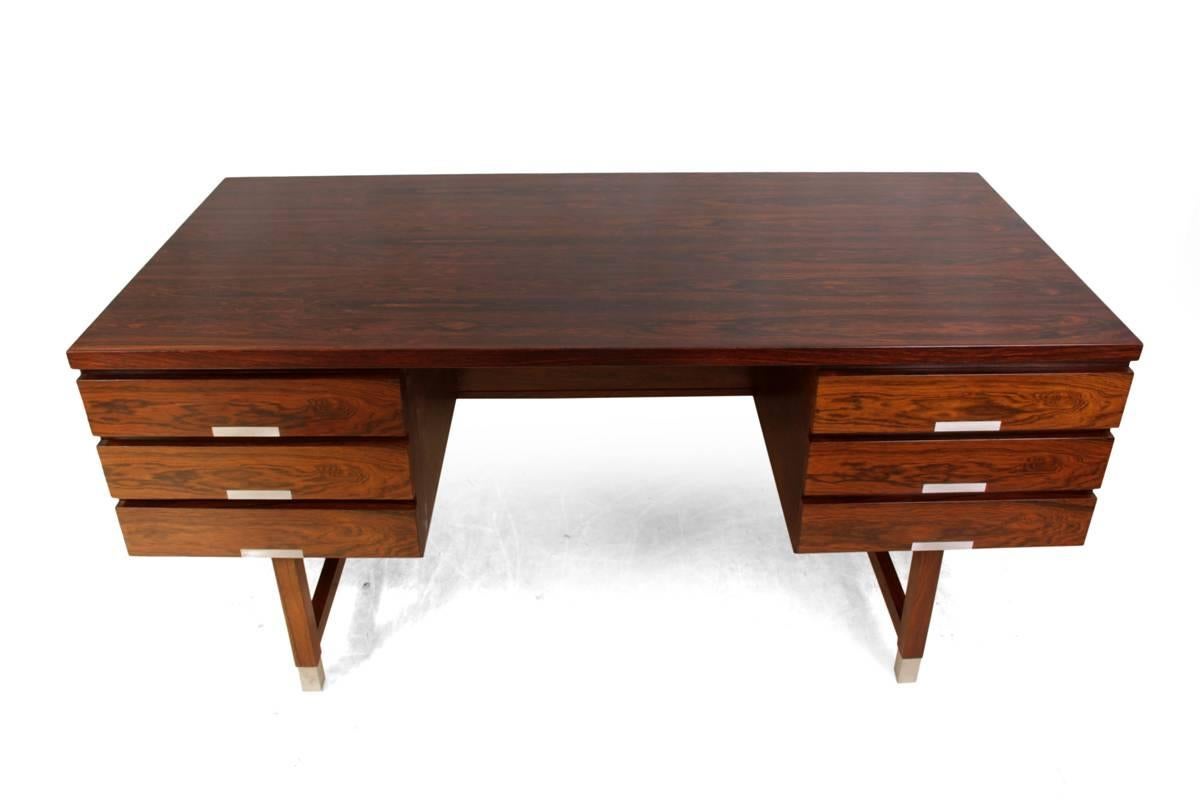 Mid-Century Rosewood EP401 desk by Kai Kristiansen, circa 1960
A very stylish desirable rosewood desk produced in the 1960s, having six drawers and open bookshelf to the back making it completely freestanding. Aluminium handles and feet tips, in