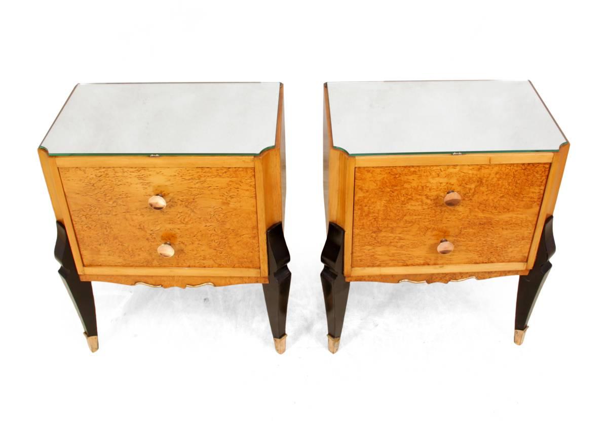 Italian Art Deco dedside tables in Karelian Birch, circa 1930
A pair of Art deco bedside table produced in Italy in the 1930s, the front door drops down to reveal a drawer, they have brass tipped feet and handles and have had the mirrored top