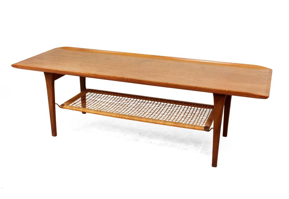 Teak coffee table by Hans Wegner, circa 1960.

This teak coffee table with rattan under tier is in original untouched condition, there are a few age related marks, we have left this table in original condition as it has beautiful patina and colour