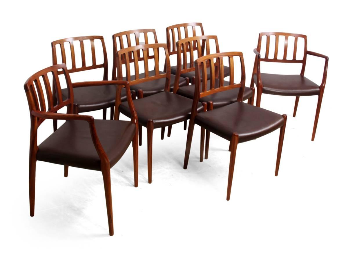 Rosewood dining chairs by N Moller model 82 set of eight

A set of eight dining chairs, six side chairs and two carvers designed by Nils Moller in the 1960s this set were produced in the 1970s from solid rosewood and having original brown leather