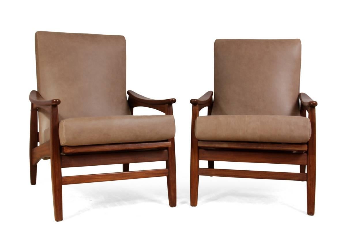 Mid-Century teak and leather armchairs, circa 1960
This pair of mid century reclining armchairs have been fully upholstered in tan leather with new webbing, the frames are solid with no old breaks, the chairs are in excellent condition