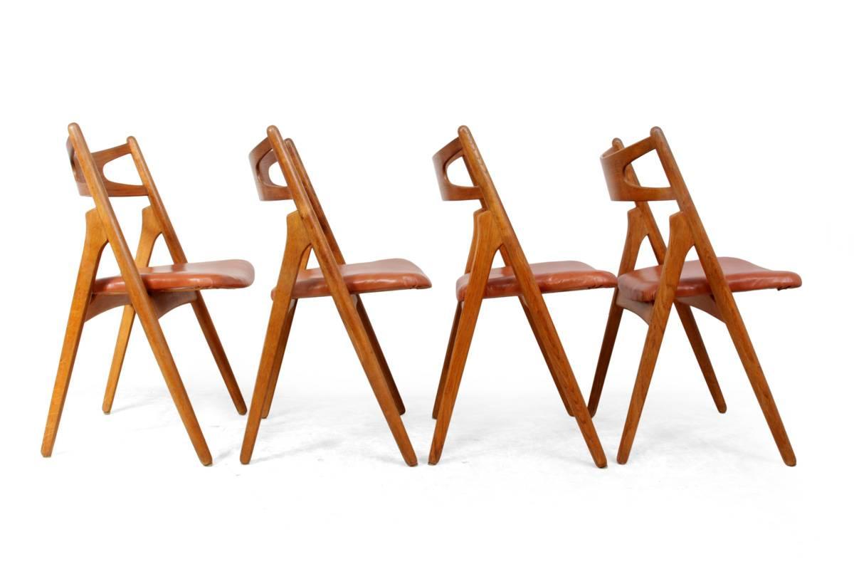 Oak saw back chairs by Hans J Wegner, circa 1960
A set of four saw back dining chairs in solid oak designed by Hans Wegner, the chairs are original early 1960s we have reupholstered the seats in quality hide tan leather and the frames have been