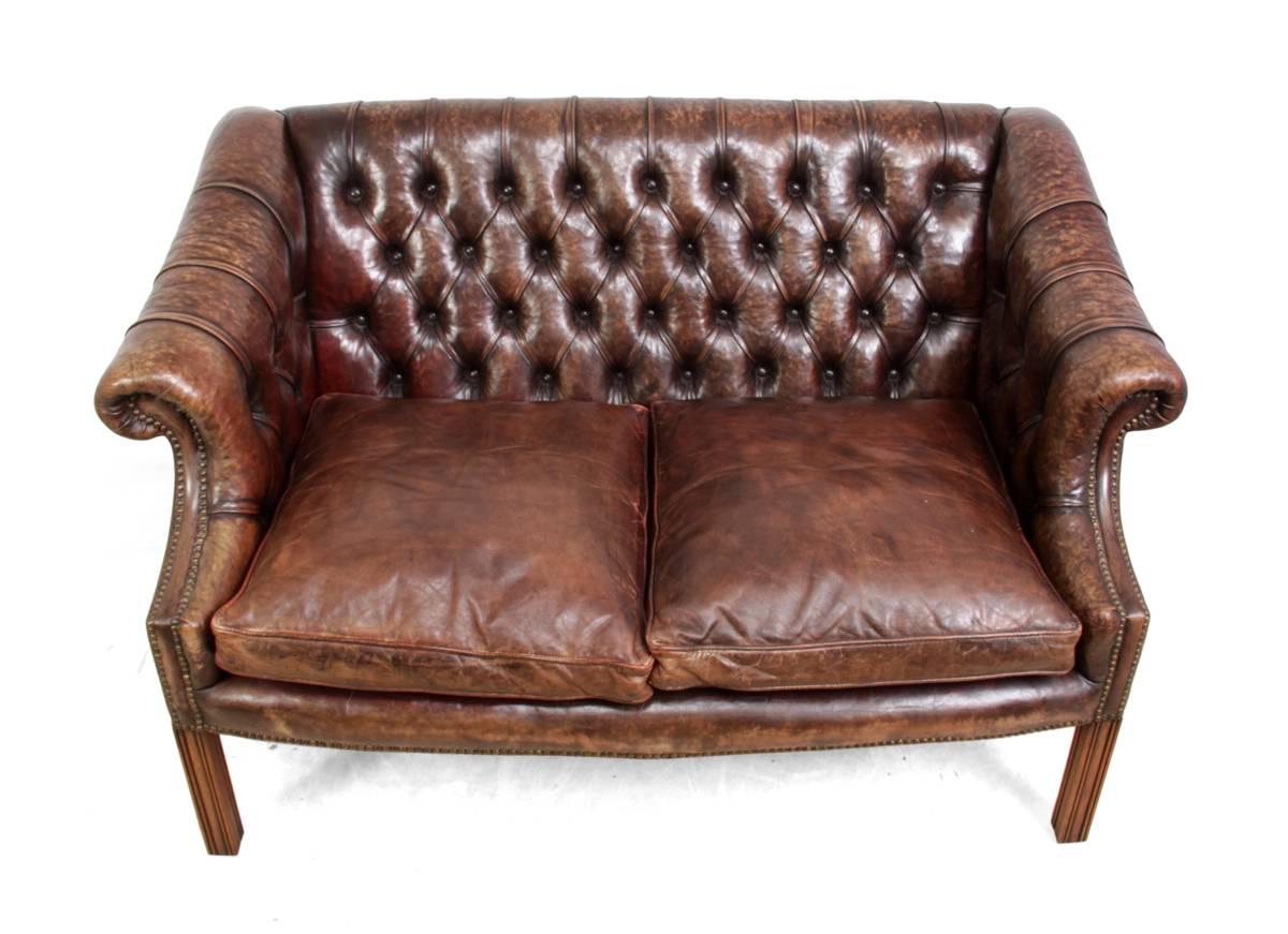 Two-seat leather club sofa.
This sofa has a solid hardwood frame, down feather cushions deep buttoned thick leather back and arms this sofa was produced in the 1980s and still is in excellent condition.
Age: 1980
Style: Classic
Material: