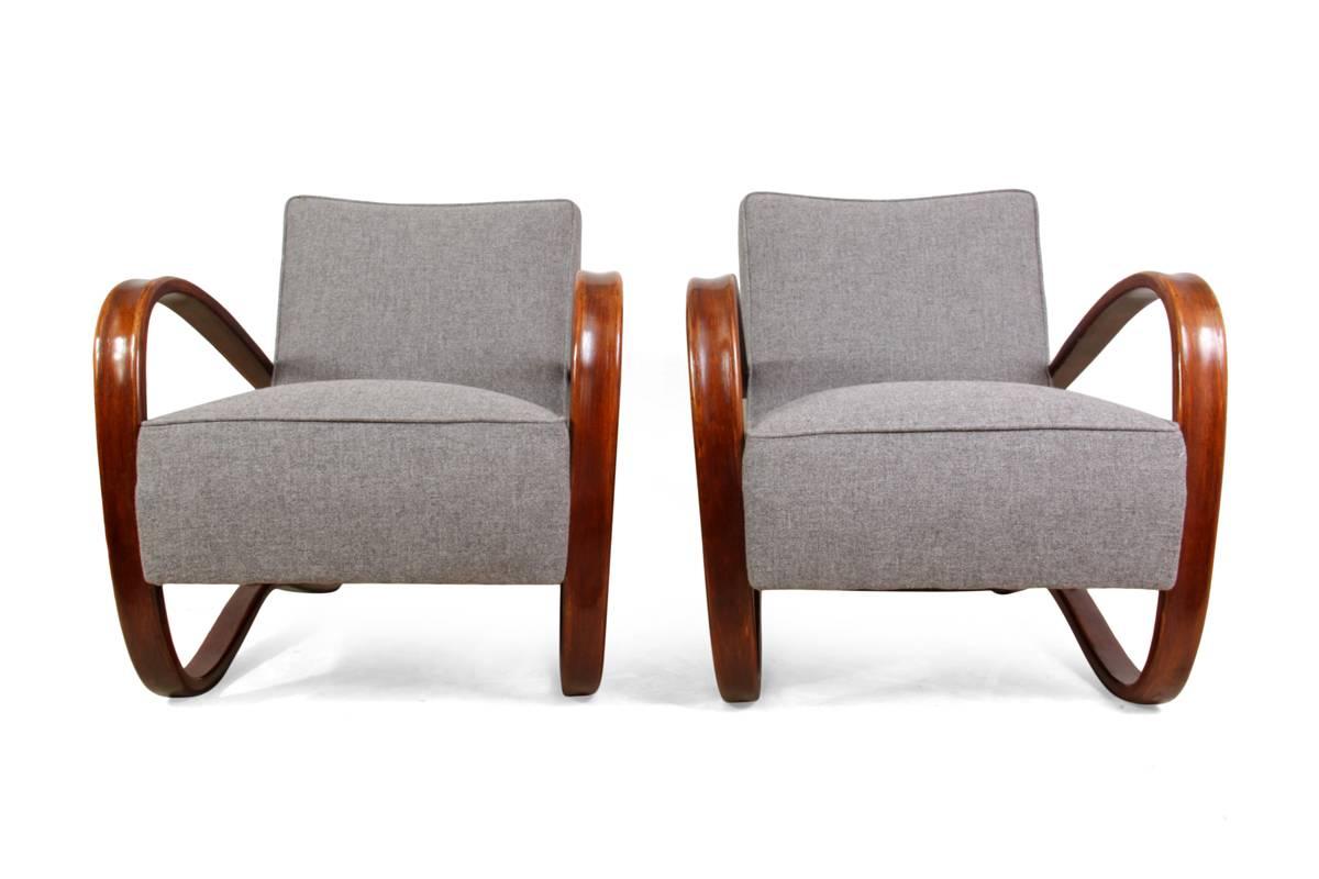 A pair of Halabala chairs H269, circa 1930
This pair of Art Deco H269 armchairs were produced by Thonet who mastered bentwood furniture in the 1930s they have been fully upholstered with piped detail and the frames polished in excellent