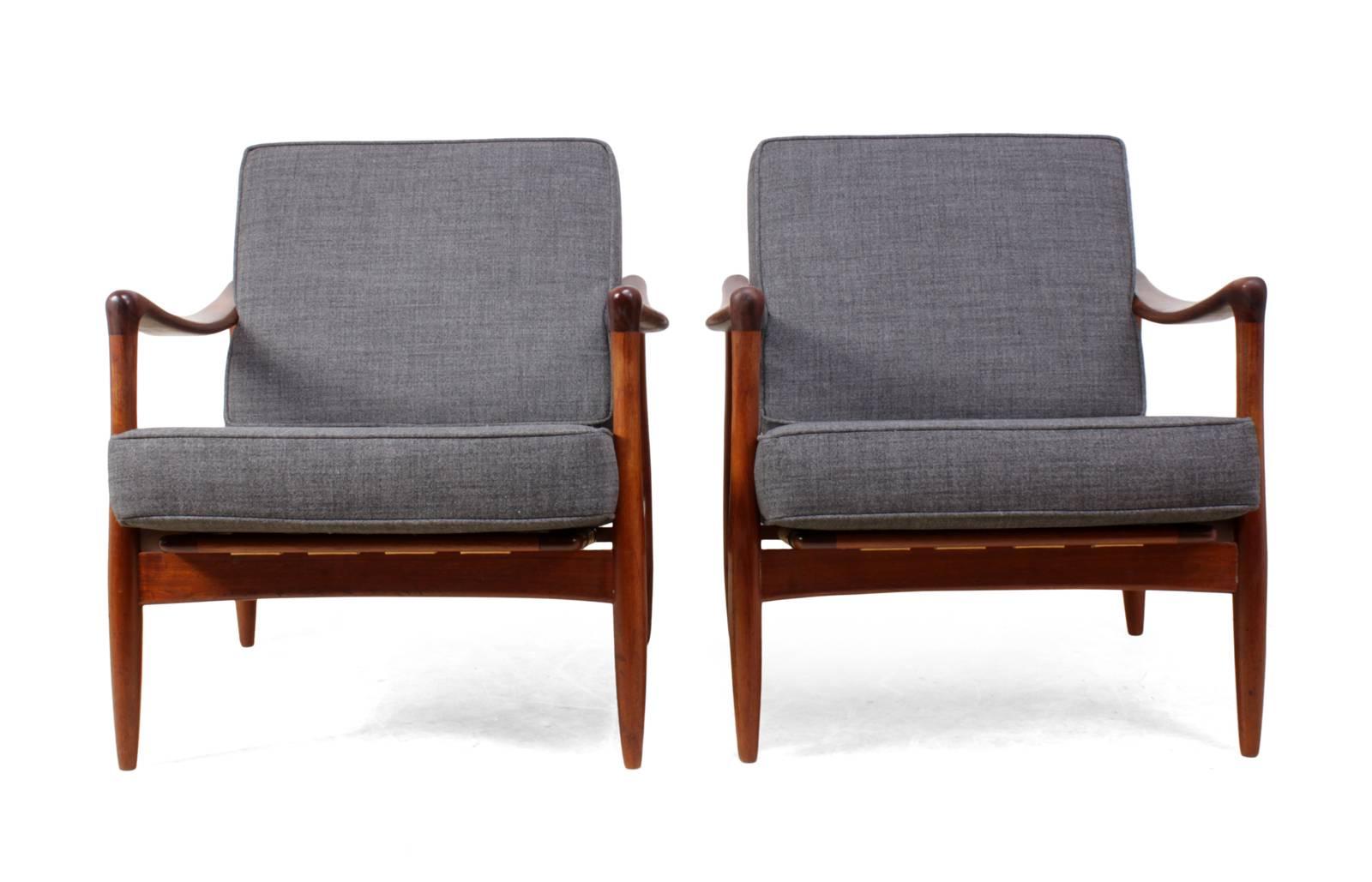 Pair of Danish Teak Armchairs
This pair of danish mid century armchairs were produced in the early 1960's they are in excellent original condition the cushions are new and have been upholstered in charcoal grey 100% wool the frames are solid with no