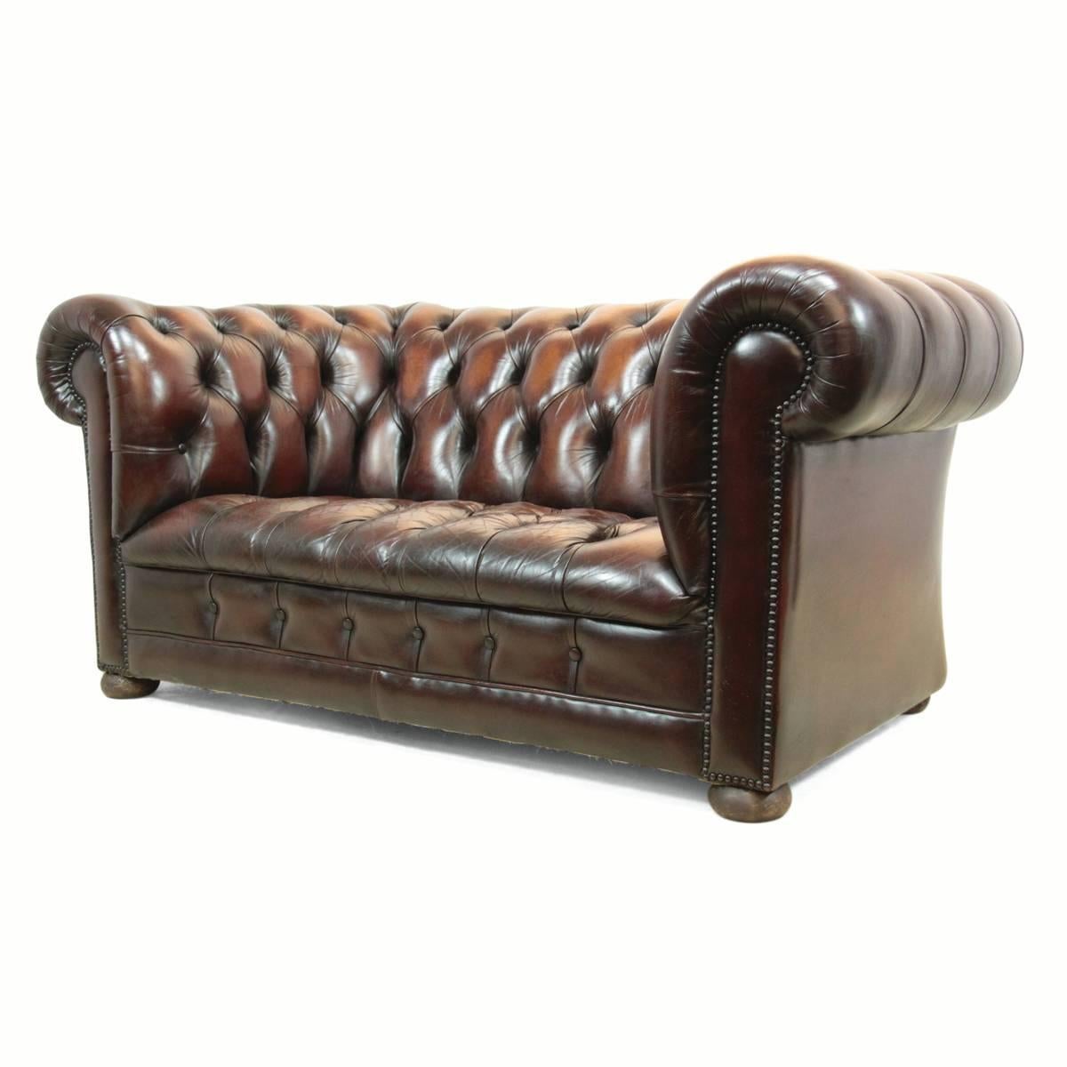 Vintage Leather Chesterfield.
This brown leather Chesterfield is a chestnut color, benefiting from a full buttoned seat and buttoned back. Produced in the 1970s using hard wood for the frame and a fully sprung seat, it is a nice comfortable