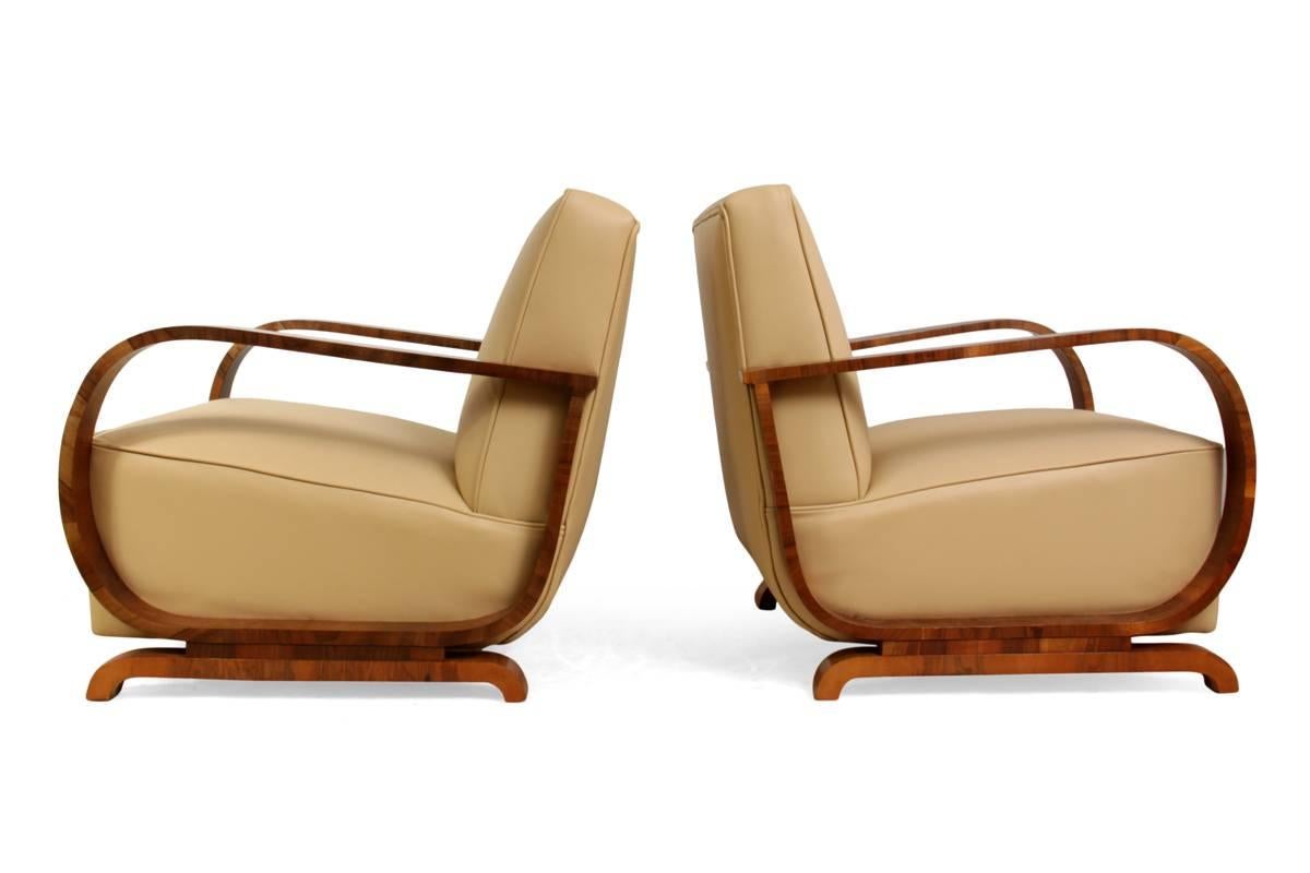 Art Deco armchairs in walnut and leather, circa 1930
A pair of Art Deco armchairs produced in Vienna, Austria in the 1930s, these chairs have been fully reupholstered in thick hide leather and the show wood has been professionally hand