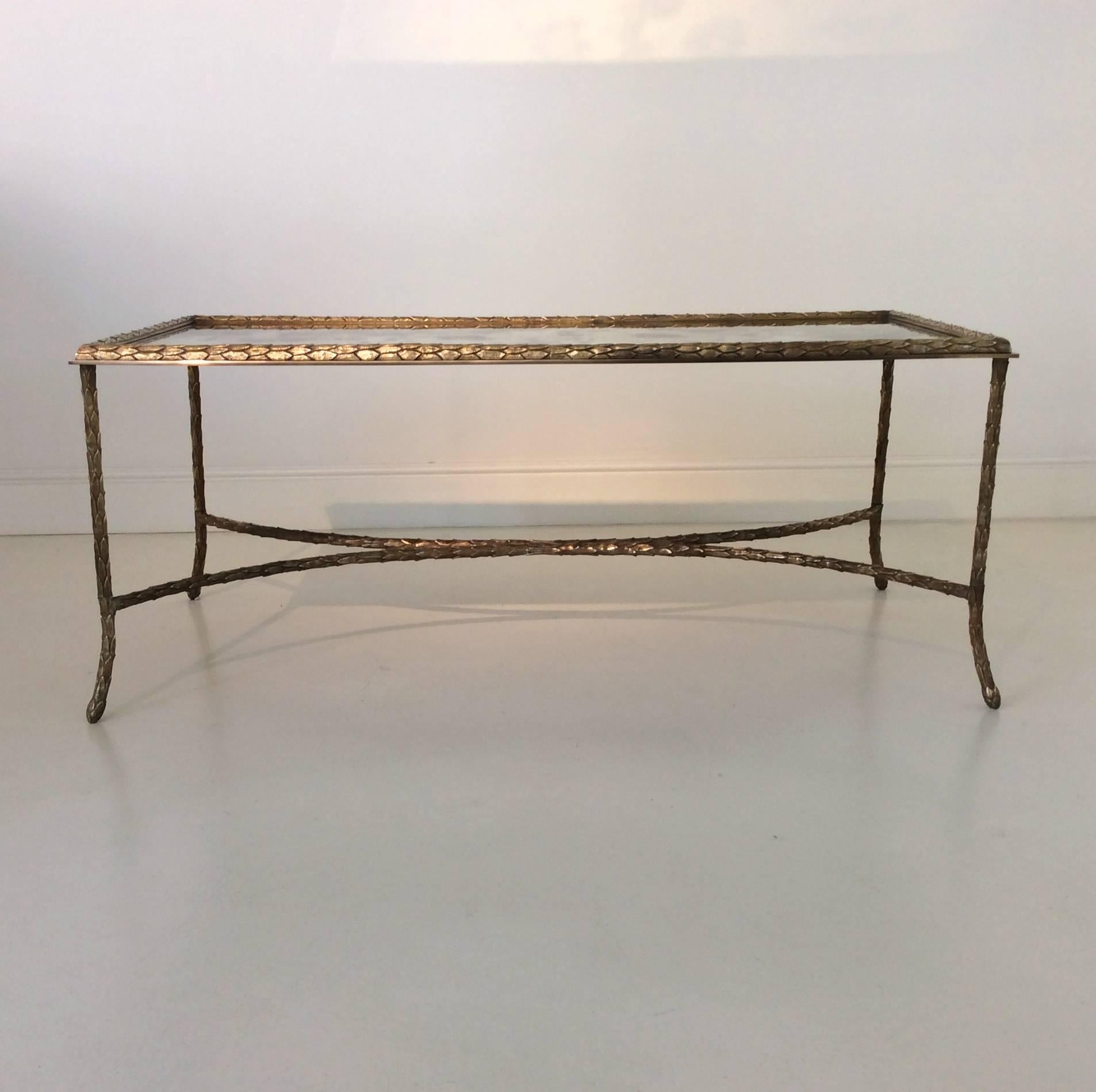 Maison Baguès coffee table, beautiful gilt bronze, oxide mirrored glass top,
France, circa 1950.
Measures: H 44 cm, W 105 cm, D 50 cm.
Very good condition.
We ship anywhere in the world, please feel free to request a cote.