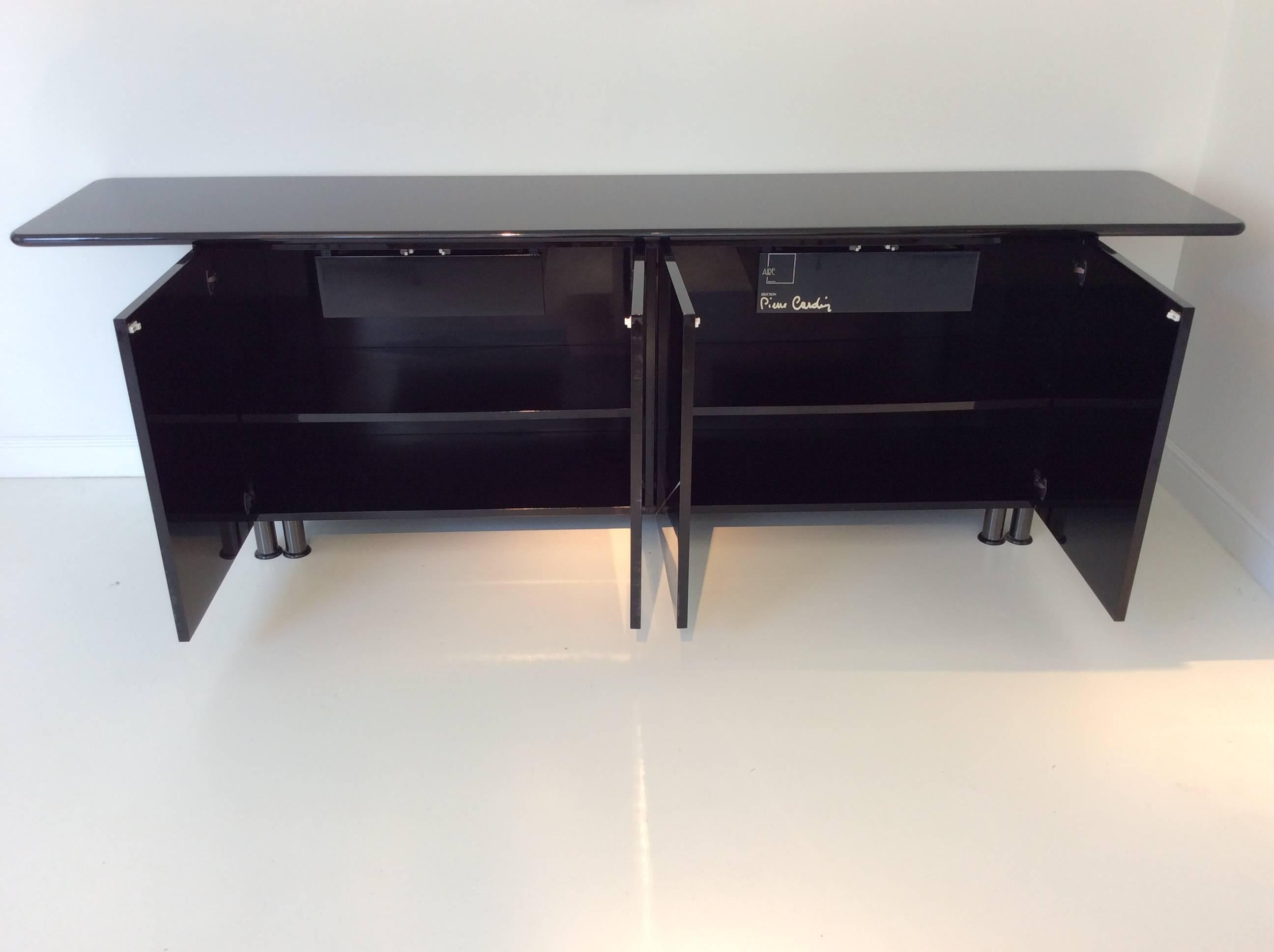 A Pierre Cardin black lacquered sideboard, circa 1980, France.
Four doors, two drawers.
Monogrammed on the right door and signed on a drawer inside.
Measures: W: 270 cm, H: 85cm, D: 55 cm.
Good original condition with some minor scratches of use.