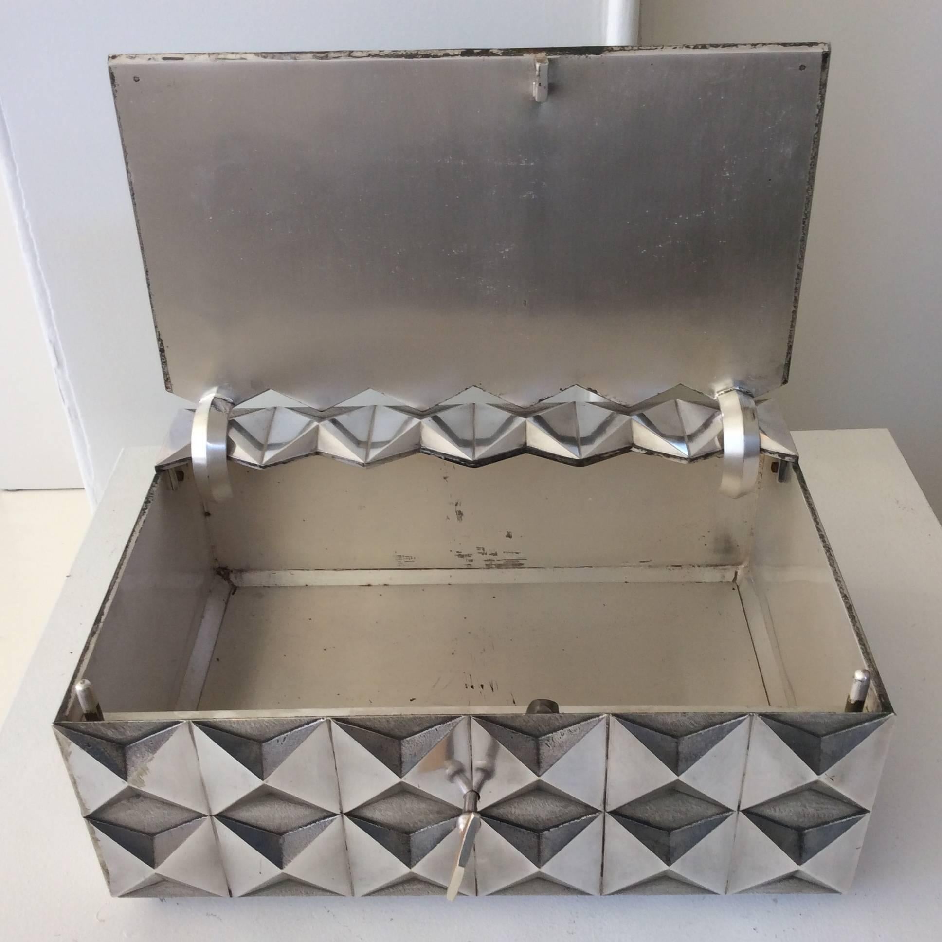 A rare silver plated metal precious box with fine diamond point patterns.
Very beautiful and high quality metal work.
Measures: W 31, D 22, H 12 cm.
Good original condition.
Probably made on special request, France, circa 1970
Exceptional