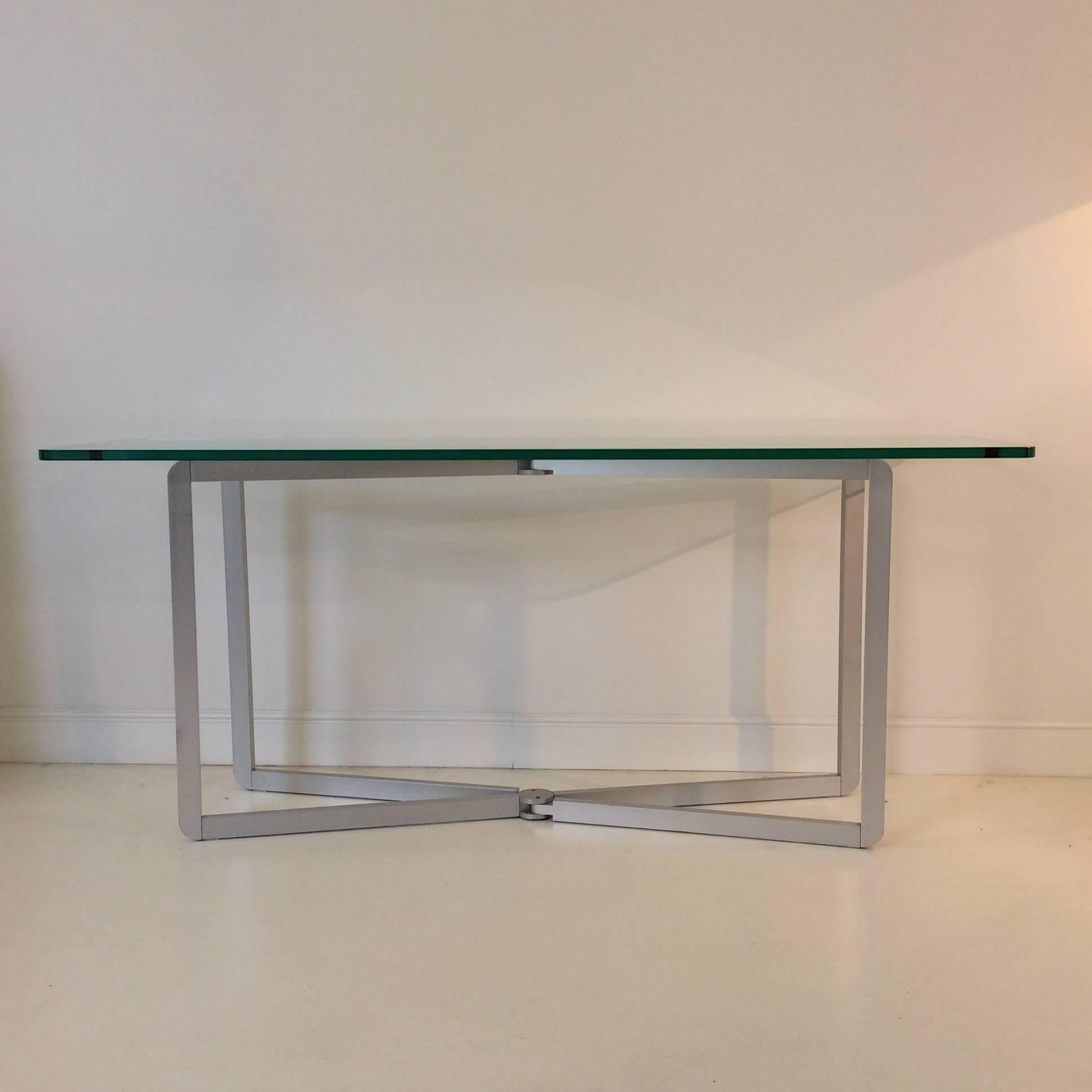 Elegant console by Michel Boyer, circa 1968, edited by Rouve, France.
Clear glass top on folding aluminium base.
Measures: H: 73 cm, W: 170 cm, D: 48 cm. Thickness of the glass: 18mm.
Very good condition.
 Lit. : P. Favardin; G. Bloch-Champfort’s