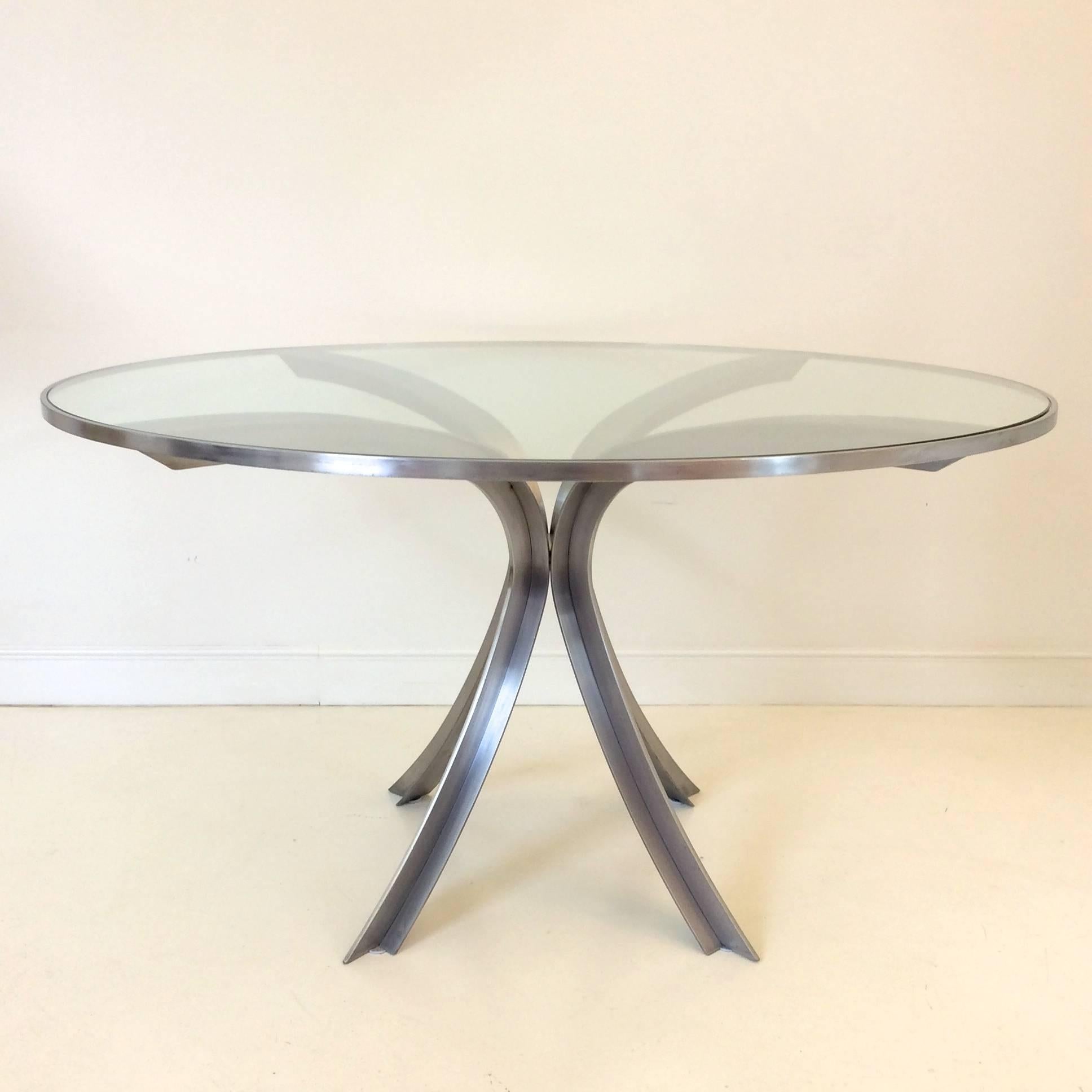 Beautiful round table by Xavier Feal, brushed steel and glass top, circa 1970, France.
Dimensions: Height 73 cm, diameter 132 cm.
Good original condition.
All purchases are covered by our Buyer Protection Guarantee.
This item can be returned within