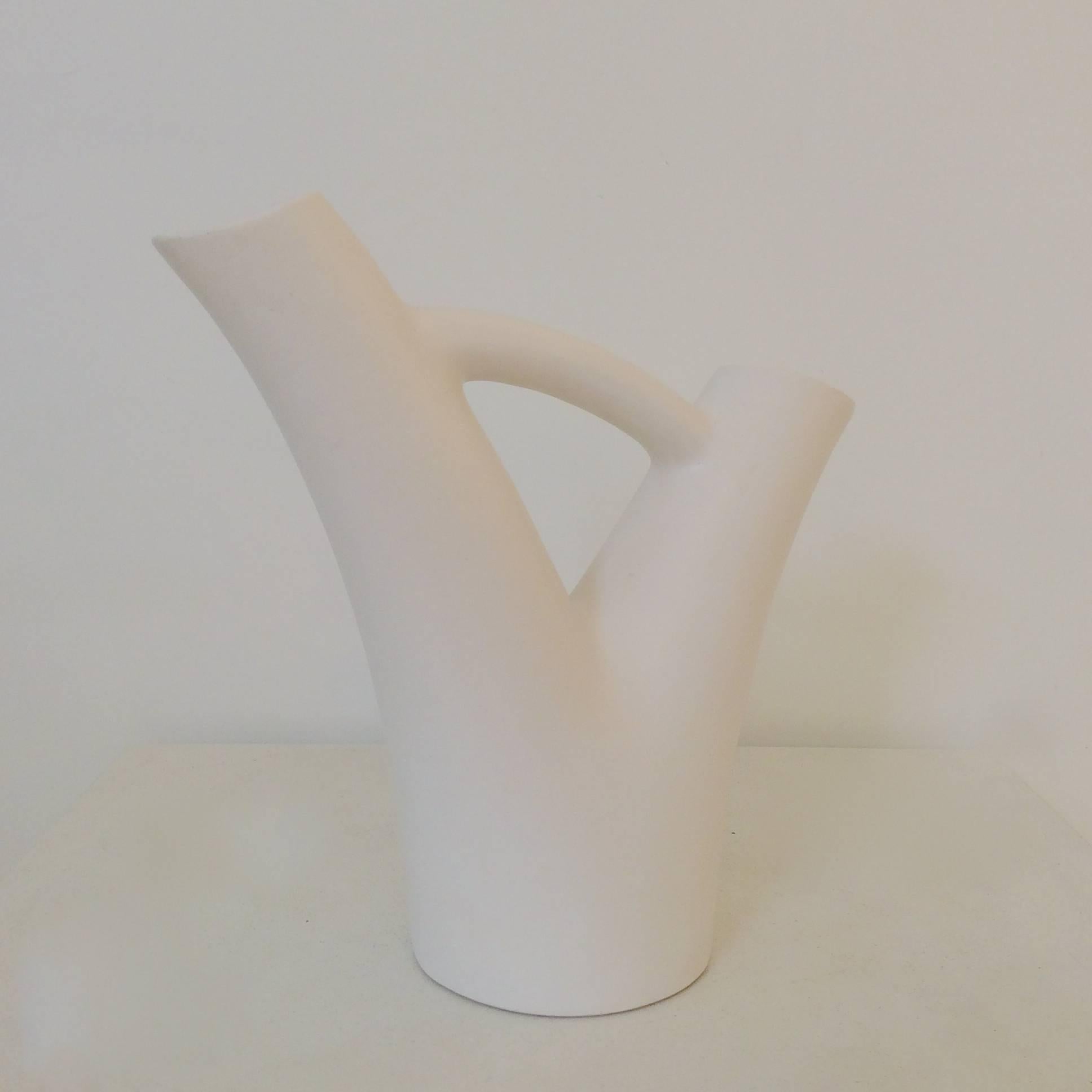 Nice André Baud (1903-1986) white glazed ceramic, circa 1950, France.
Dimensions: 28 cm H, 30 cm W, 12 cm D
Signed underside: A.Baud, Vallauris.
 We ship worldwide.