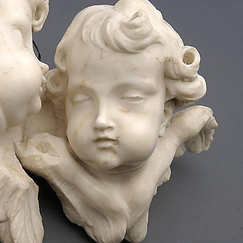 Exceptional 19th century Italian carved marble bust plaque of two cherubs. Finely hand-carved with immaculate attention to detail and realism.