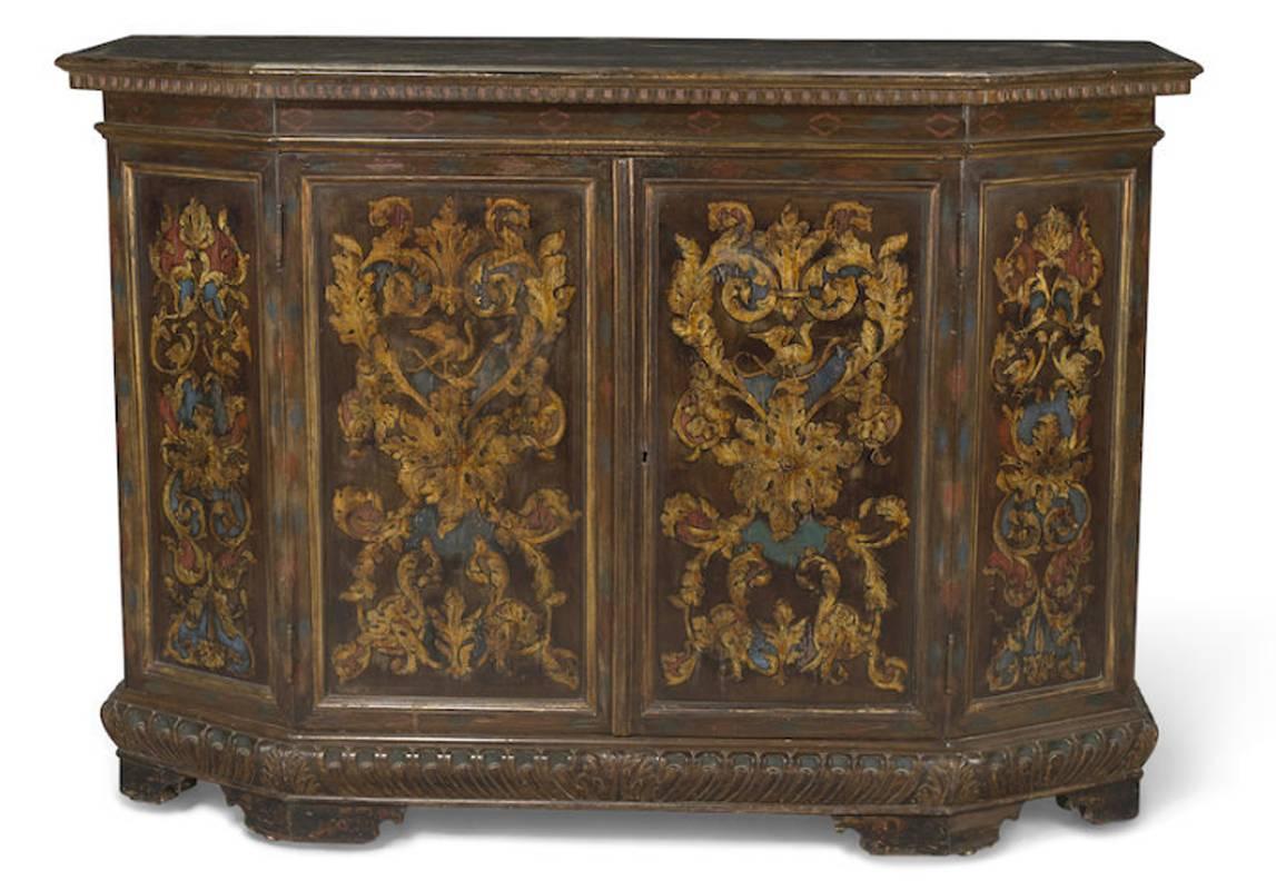 Beautiful 19th century Italian Baroque style painted two-door credenza on bracket feet. Intricately decorated with a red, blue and gold color scheme throughout the front and the sides of the credenza.