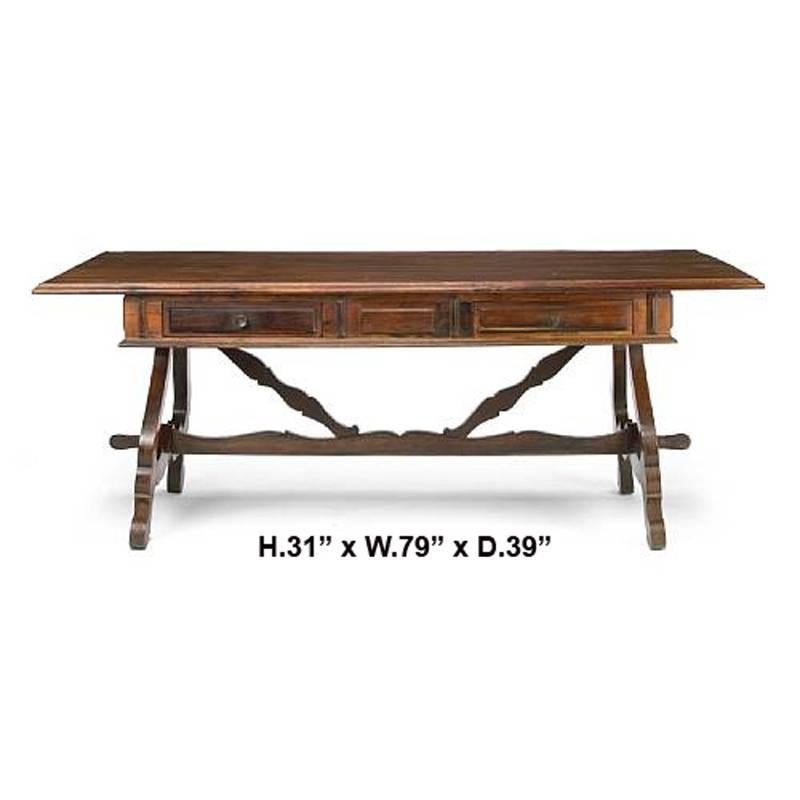 Exceptional pair of 19th century Portuguese Jacaranda wood trestle tables with wide wooden top above a frieze with two drawers supported by four carved legs joined by wood stretchers. Possibly Brazilian.

The fact that they are a pair and made