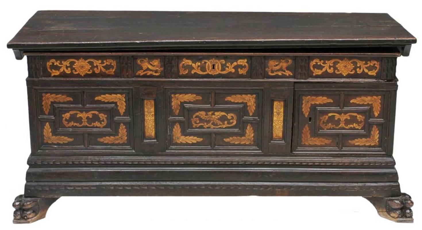 Unique 18th century Spanish Renaissance inlaid walnut Cassone with three drawers, which is very unusual to find in cassones, and resting on carved lion feet. 

Possibly earlier than 18th century.