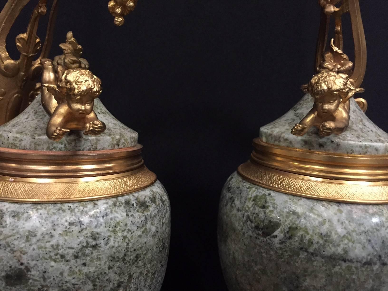 Pair of French Ormolu-Mounted Marble Urns with Cherubs In Good Condition In Cypress, CA