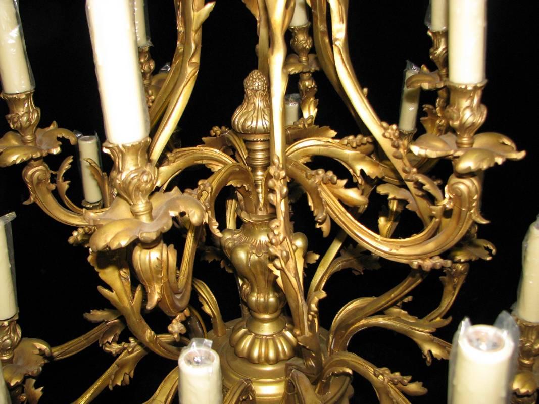 Pair of Louis XV Style Bronze Eighteen-Light Chandeliers 1