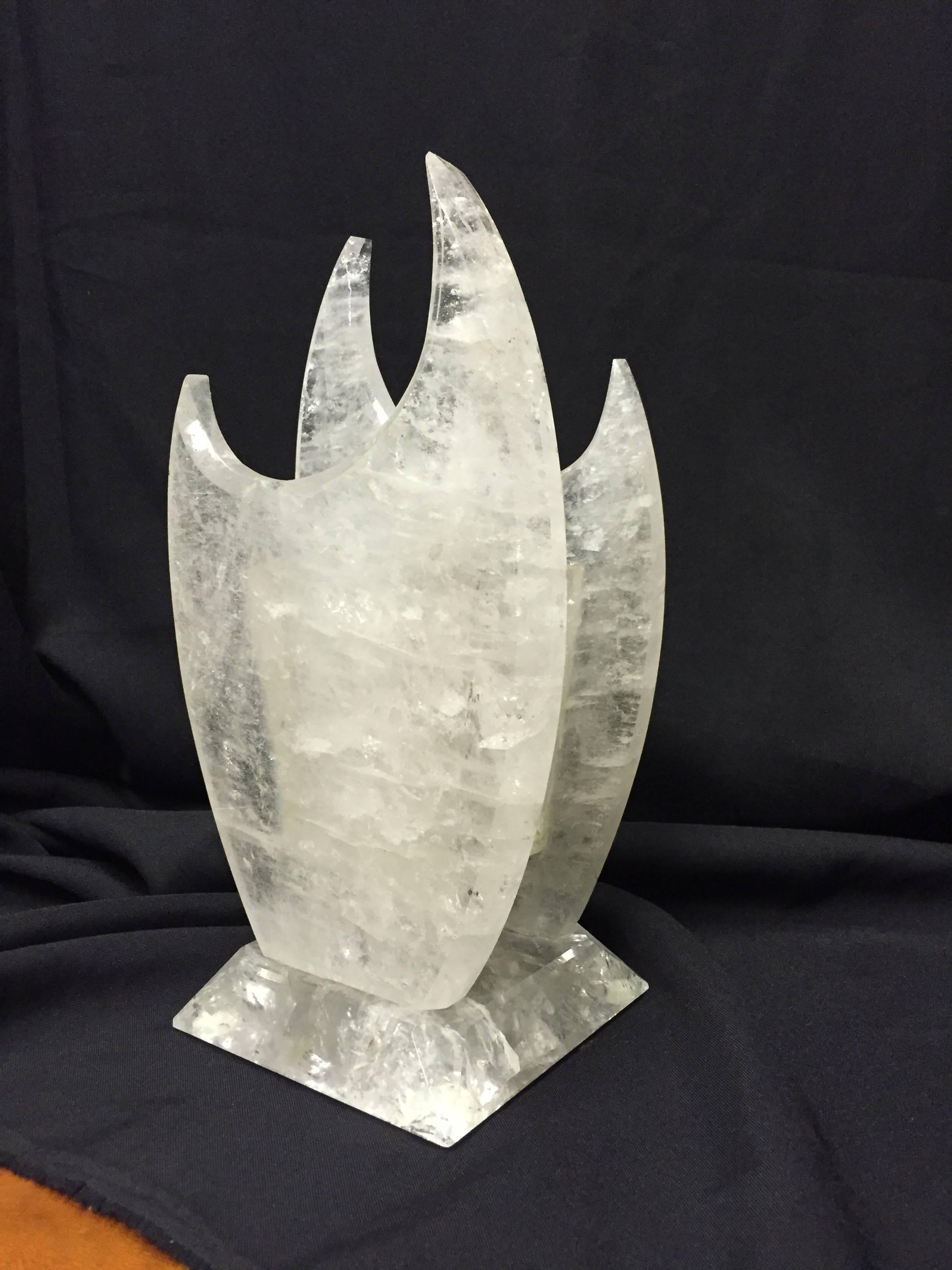 Unique modern hand-carved and hand polished rock crystal vase with crescent shaped top.

 