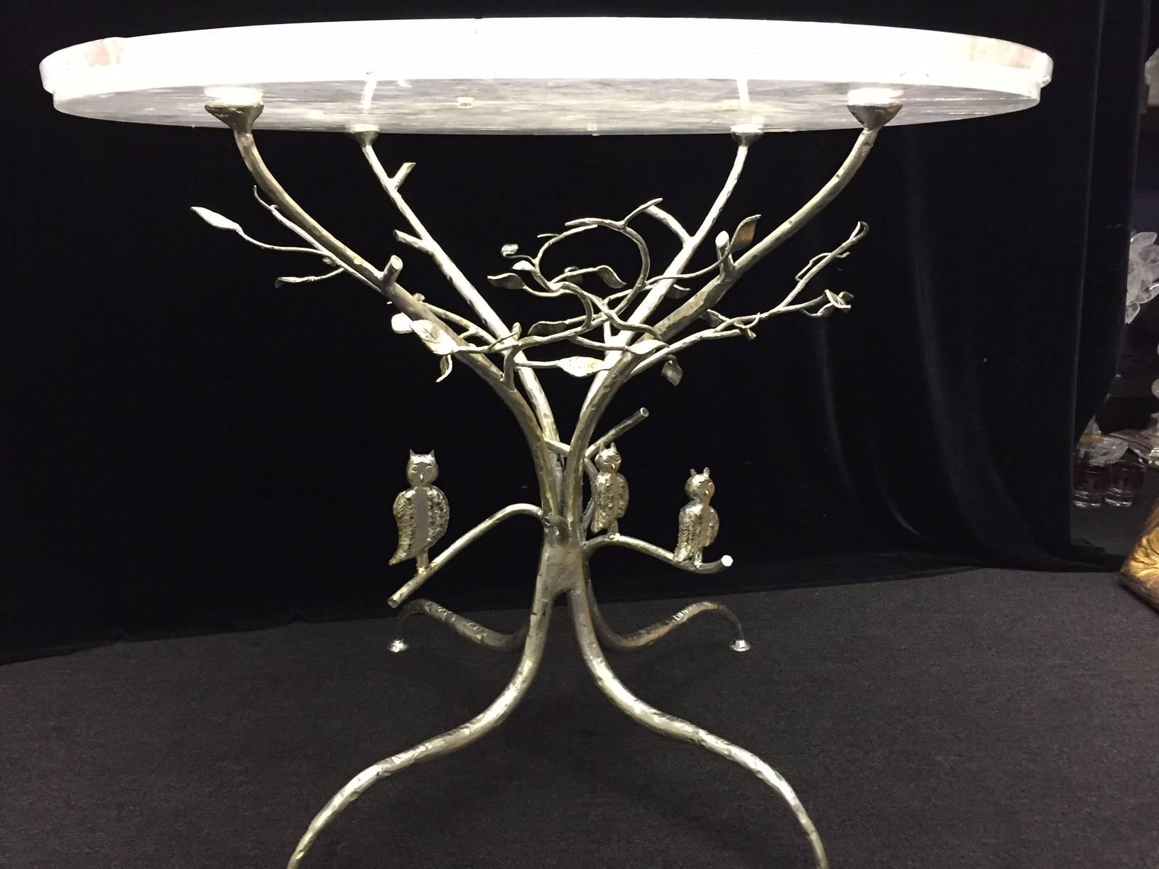 One of a kind modern fine round rock crystal table on hand forged and silver-leafed iron tree form base with three owls.
