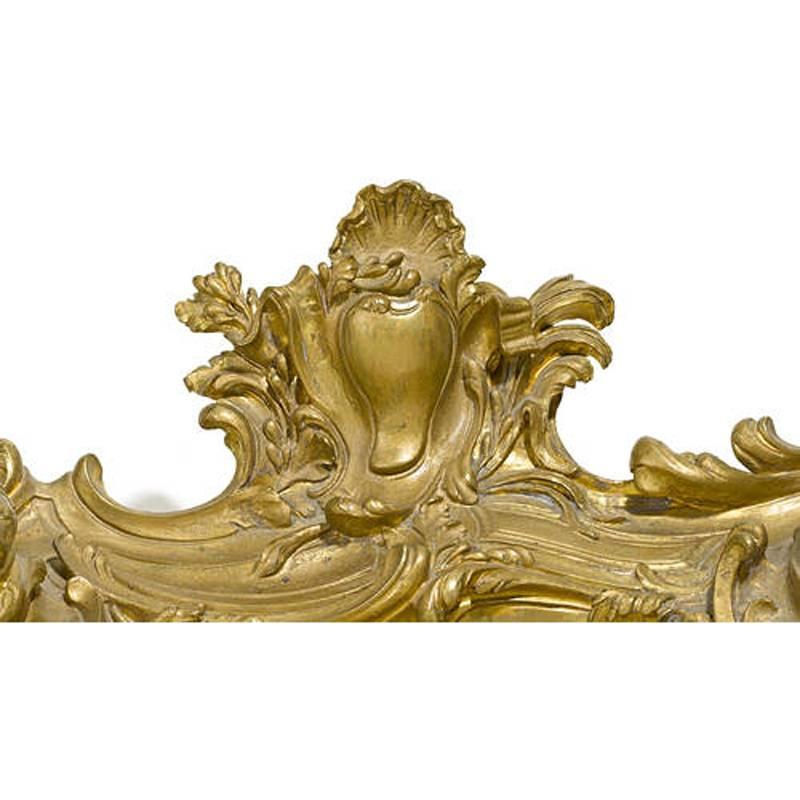 Beautiful 19th century Louis XV style ormolu inkwell. The C-scroll and foliate shaped encrier topped with rocaille decoration flanked by twin hinged inkwells with pierced tops and (detailed photos of finials on inkwells for decoration description)