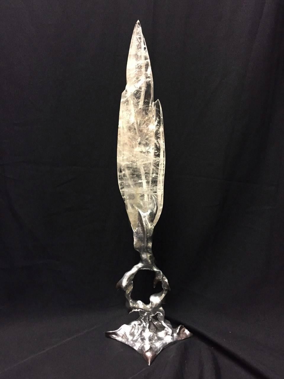 Impressive one of a kind modern style fine quality hand carved rock crystal flame on hand forged wrought iron artistic stand.