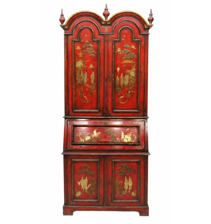 Fine Queen Anne style red Japanned chinoiserie secretary cabinet. The double domed top with three urn finials over two doors revealing two shelves, on slantfront desk over two additional doors on four bracket feet. The interior is green decorated