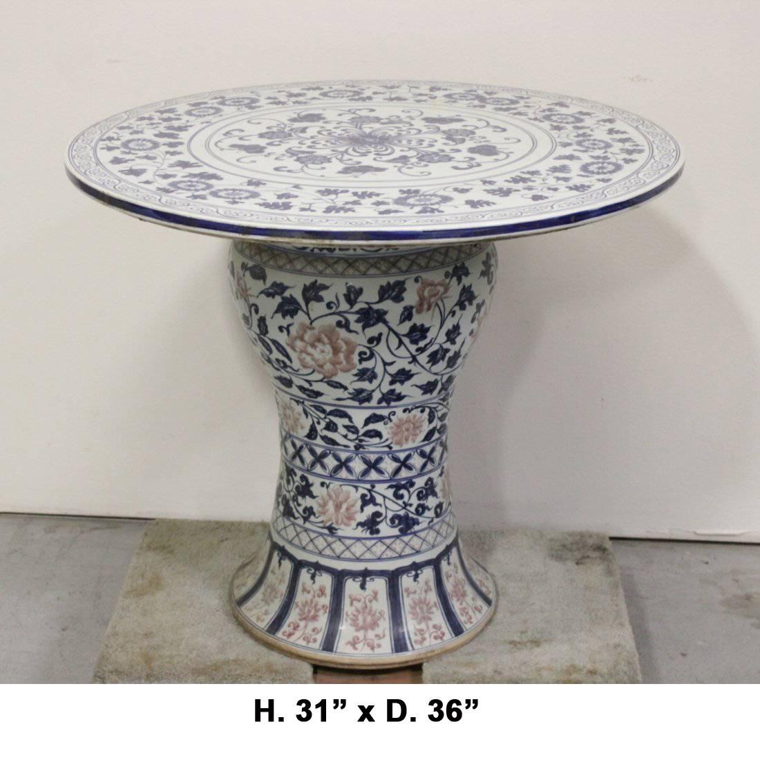 Large and rare Chinese finely hand-painted blue and white porcelain round table. Floral and leaf decorated round top on hand-painted porcelain base.

 Very rare to find a blue and white porcelain table. 

 