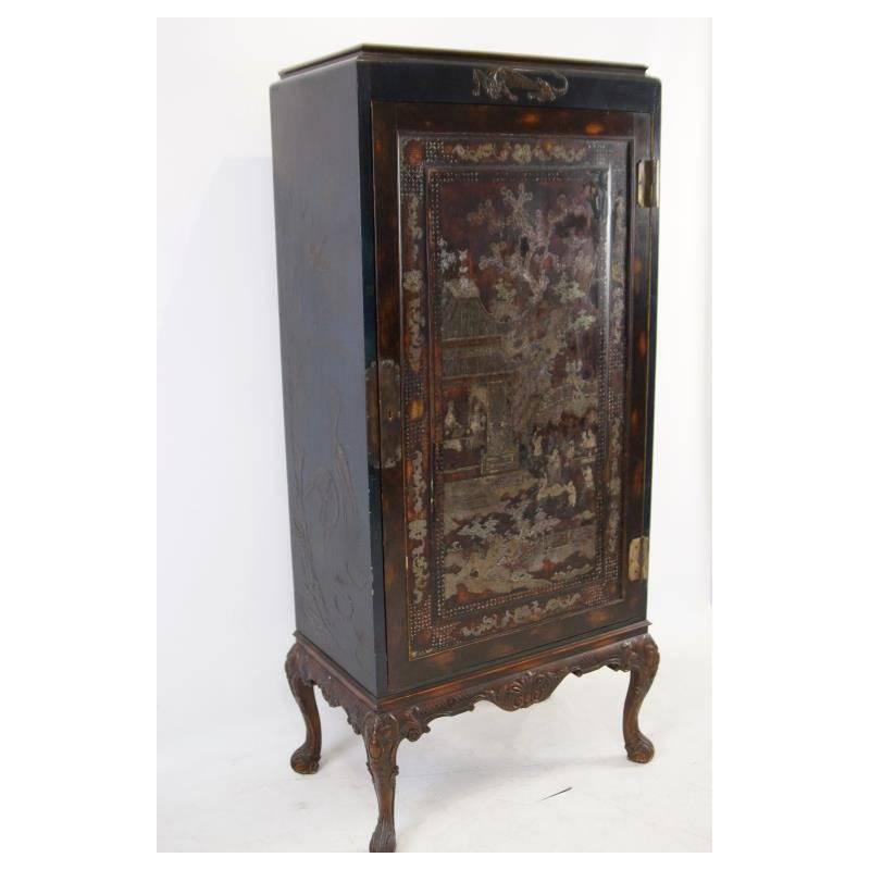 Unique antique Chinese export mother-of-pearl inlaid and lacquer cabinet on stand, with a beautifully inlaid decorated Oriental figural scene door revealing ten satinwood shelving units and one drawer. The sides are lacquer on gesso decorated, all