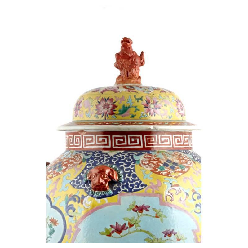 Attractive and large Chinese hand-painted floral design porcelain ginger jar decorated with molded animal masks, circa 1900.

  