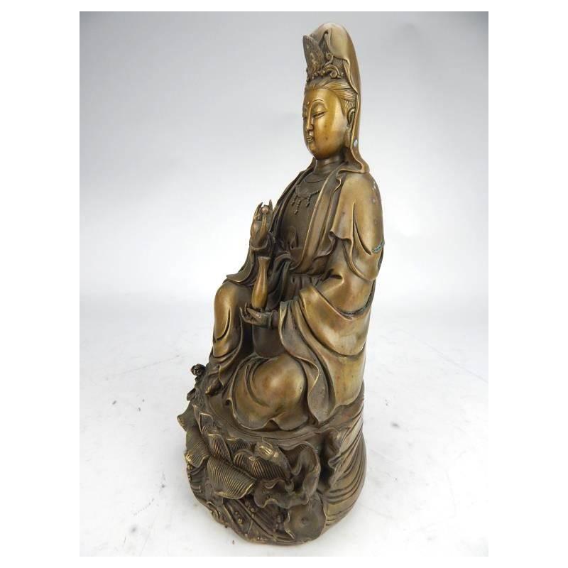 Fine signed antique Chinese patinated bronze Quan Yin holding a vase and seated on a lotus flower, early 20th century. 

 